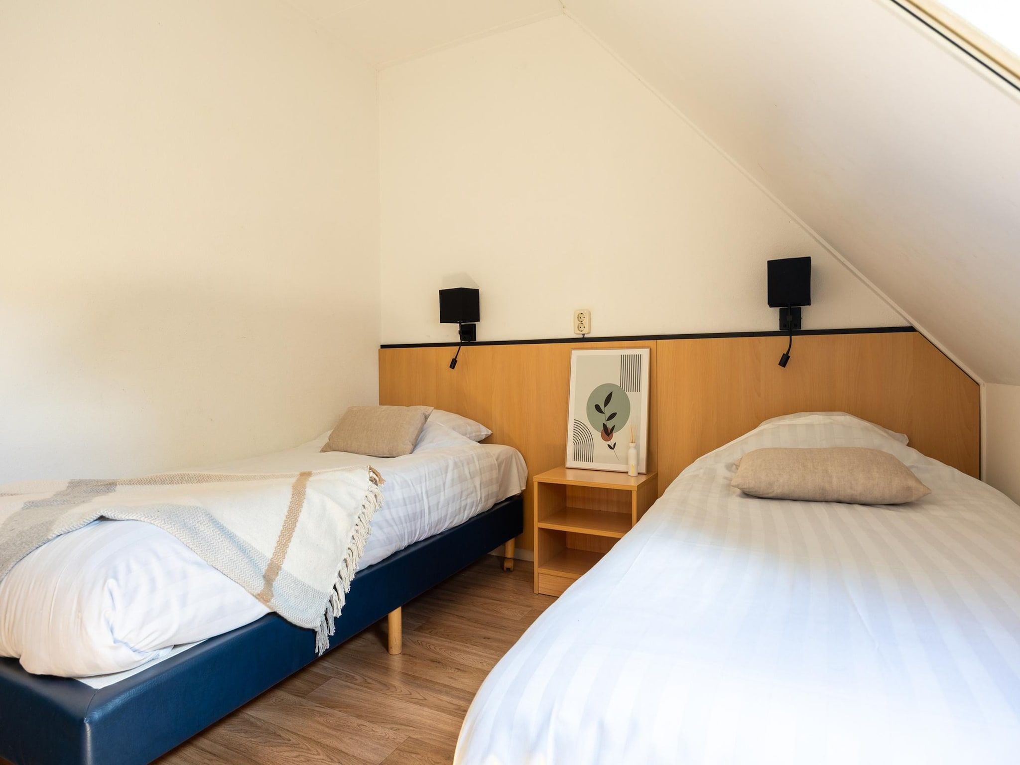 Een slaapkamer van Alkmaar 12 in Andijk