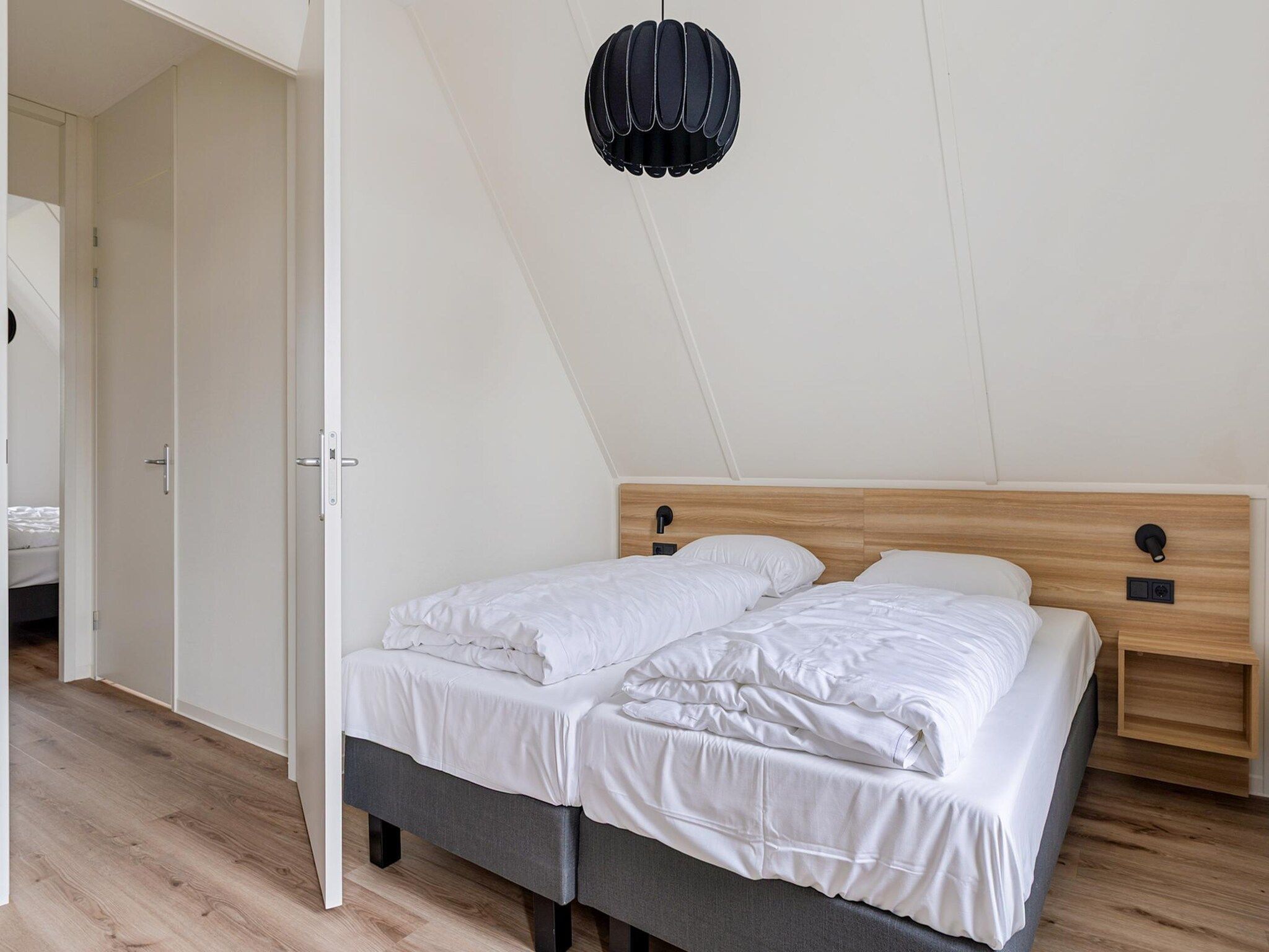 Een slaapkamer van Koggehuys Binnen in PS Opperdoes