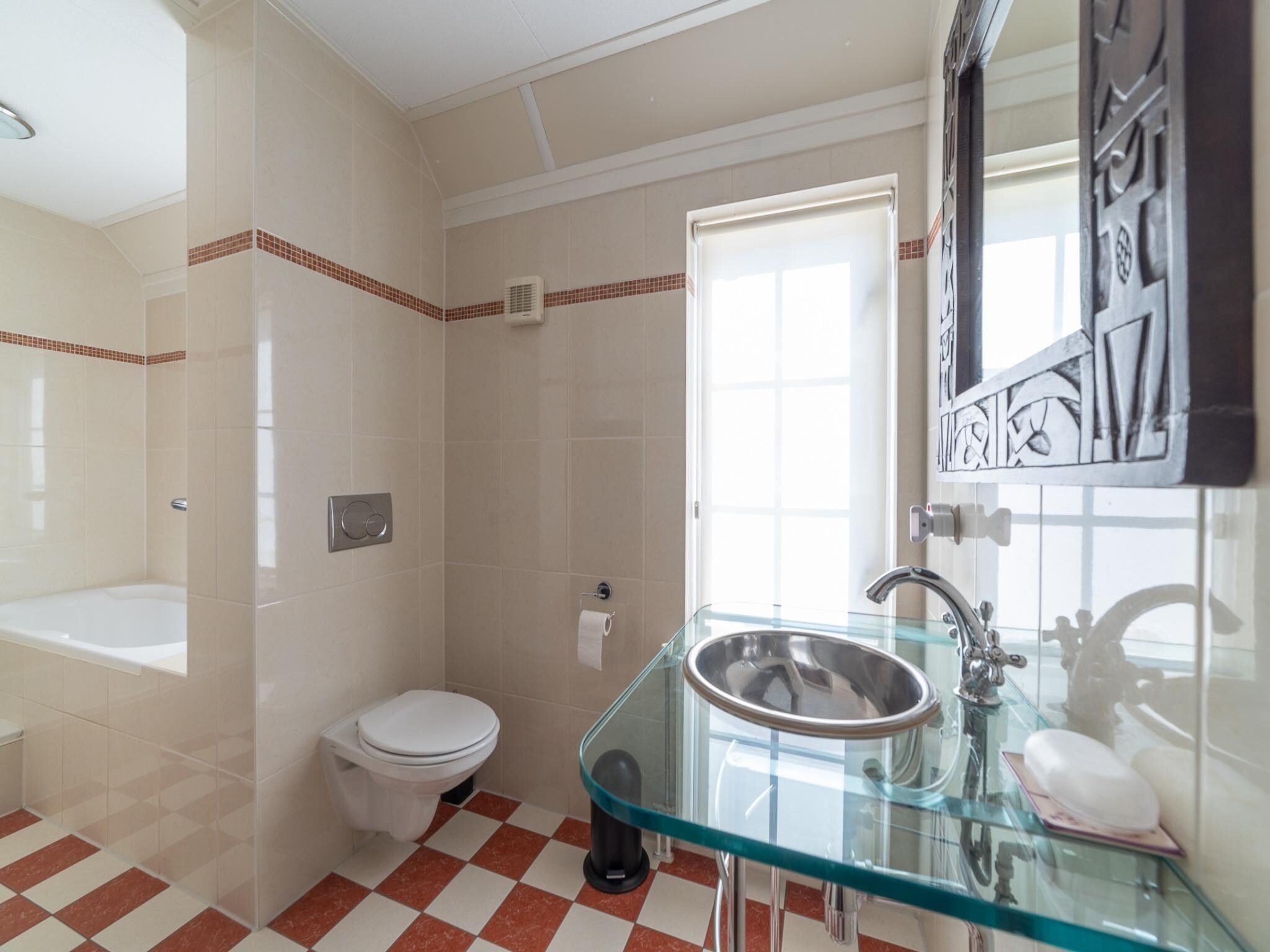 De badkamer van Villapark De Oesterbaai 134 in Wemeldinge