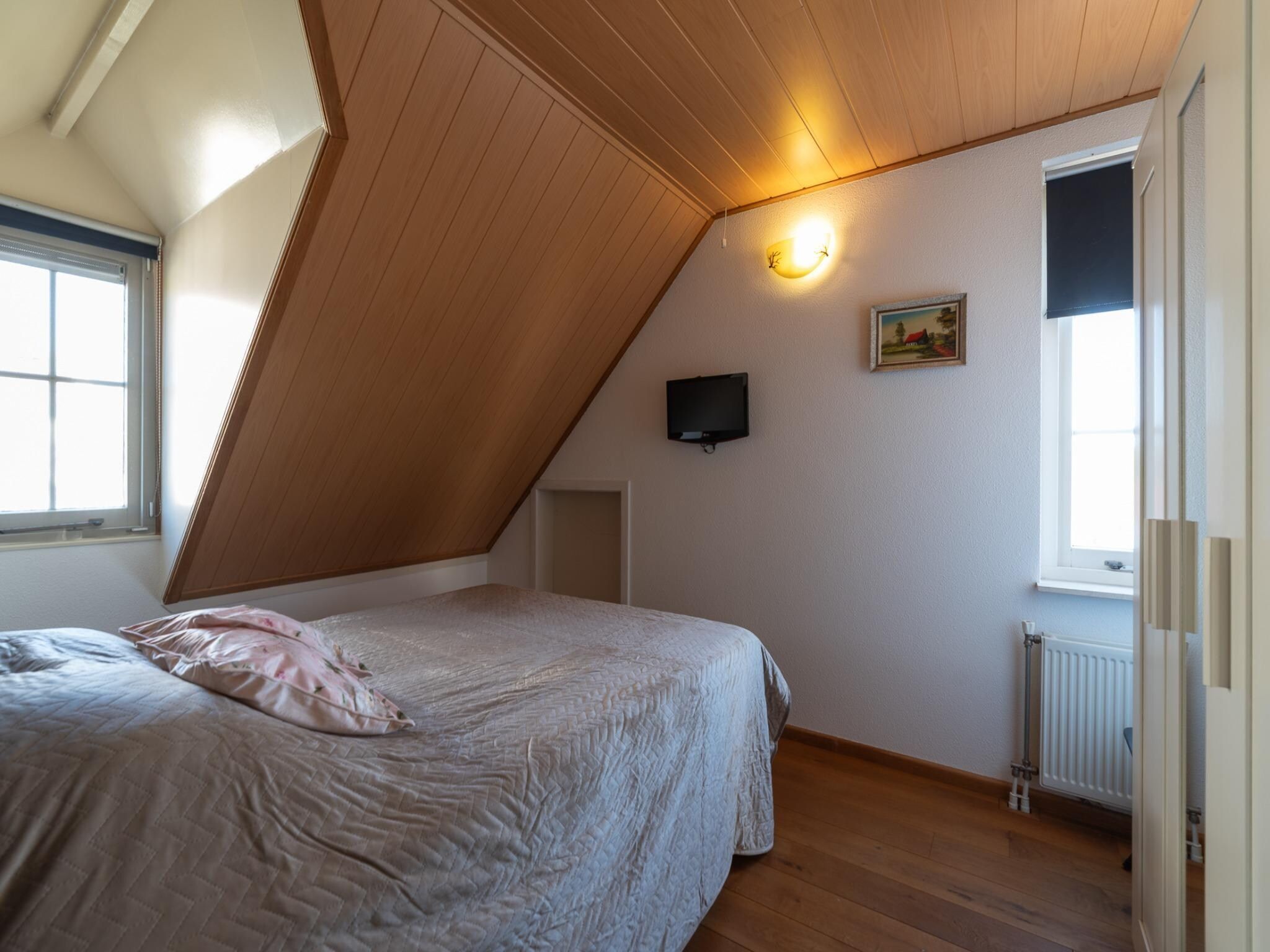 Een slaapkamer van Villapark De Oesterbaai 134 in Wemeldinge