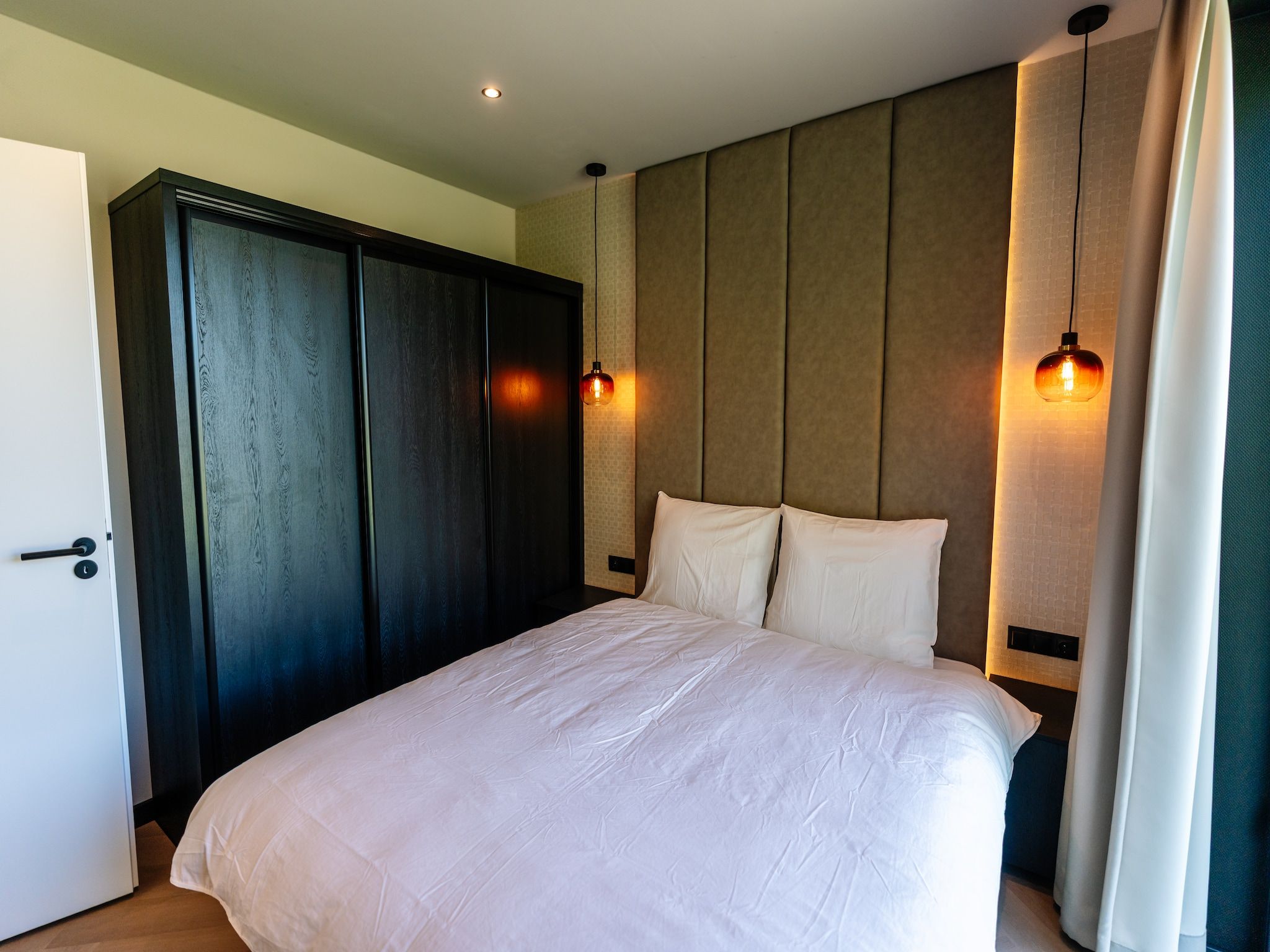 Een slaapkamer van Villa Watergloed | 10 personen in Waarland