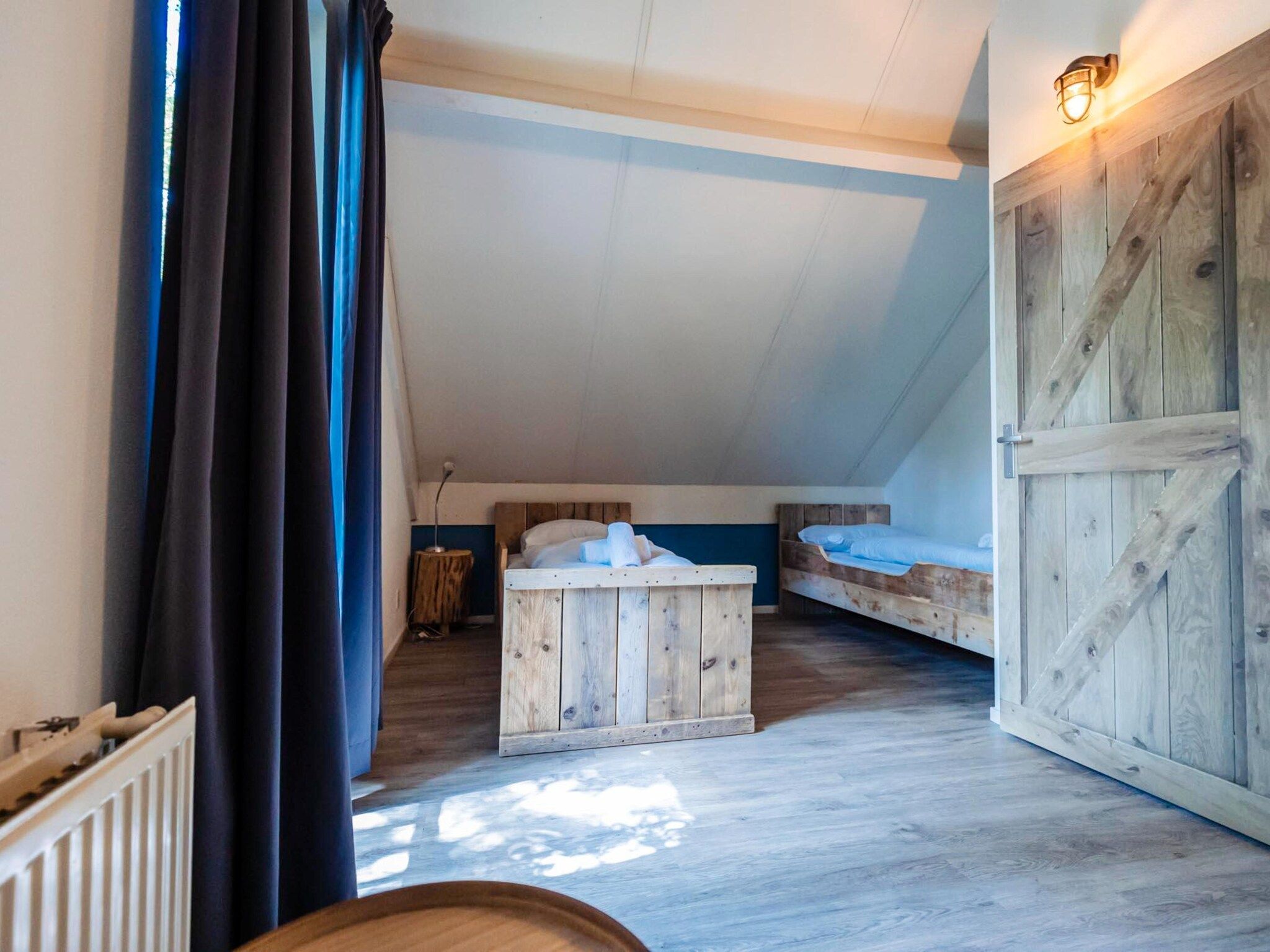 Een slaapkamer van 6 - Persons Lakeside Child-friendly Bungalow in Ewijk