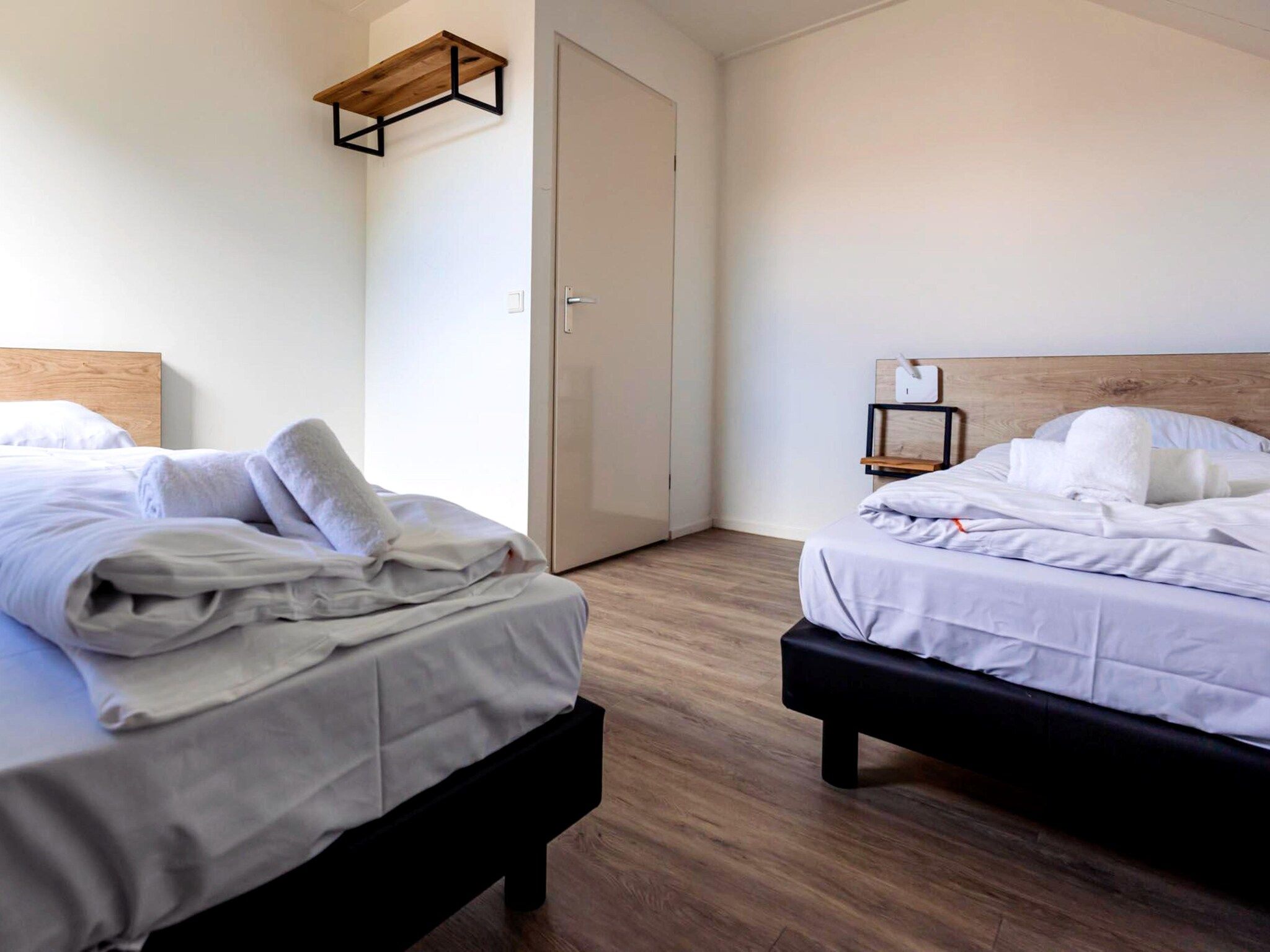 Een slaapkamer van 8 - Persons Family bungalow in Ewijk