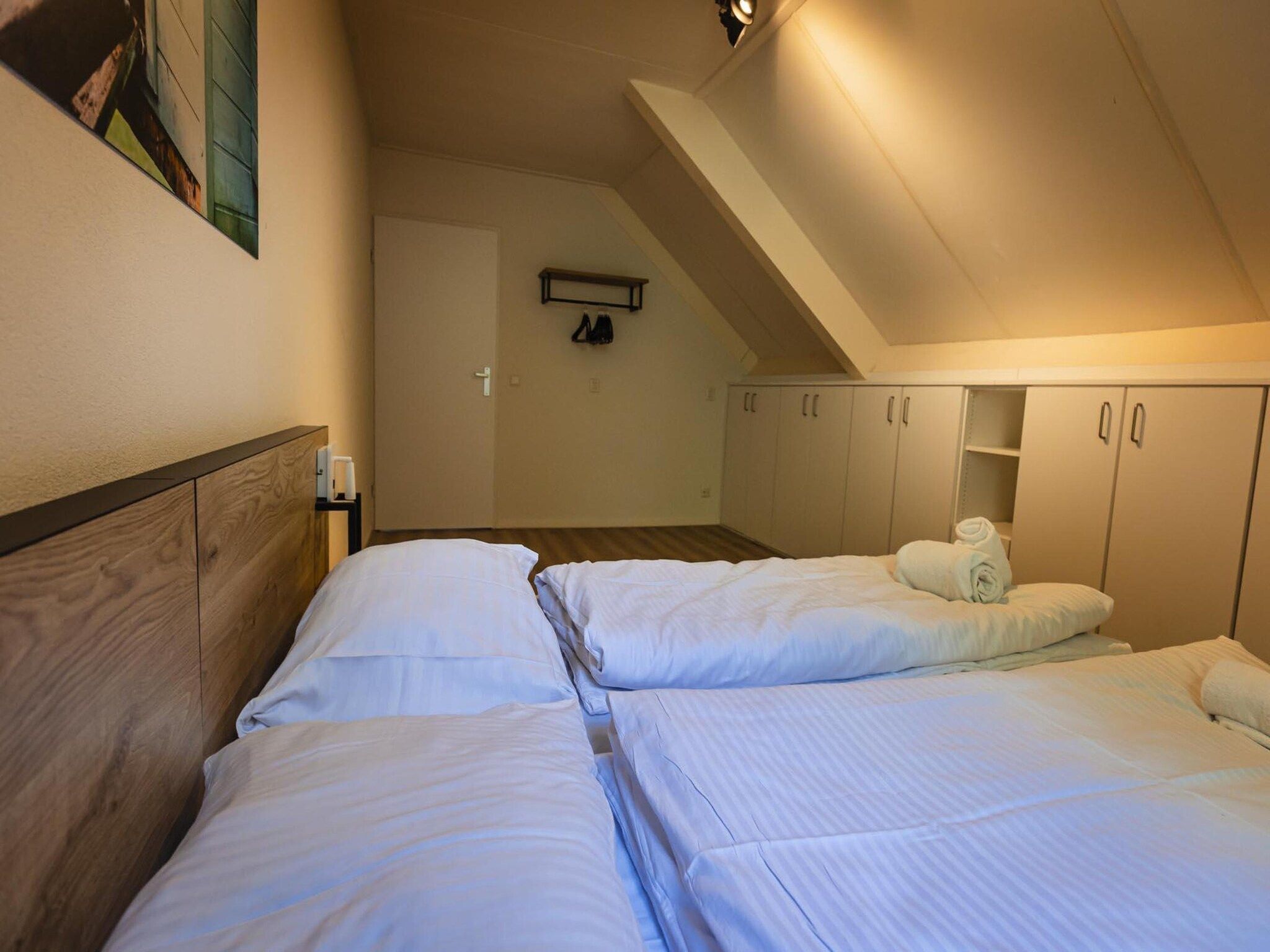 Een slaapkamer van 12 - Persons Family Bungalow in Ewijk