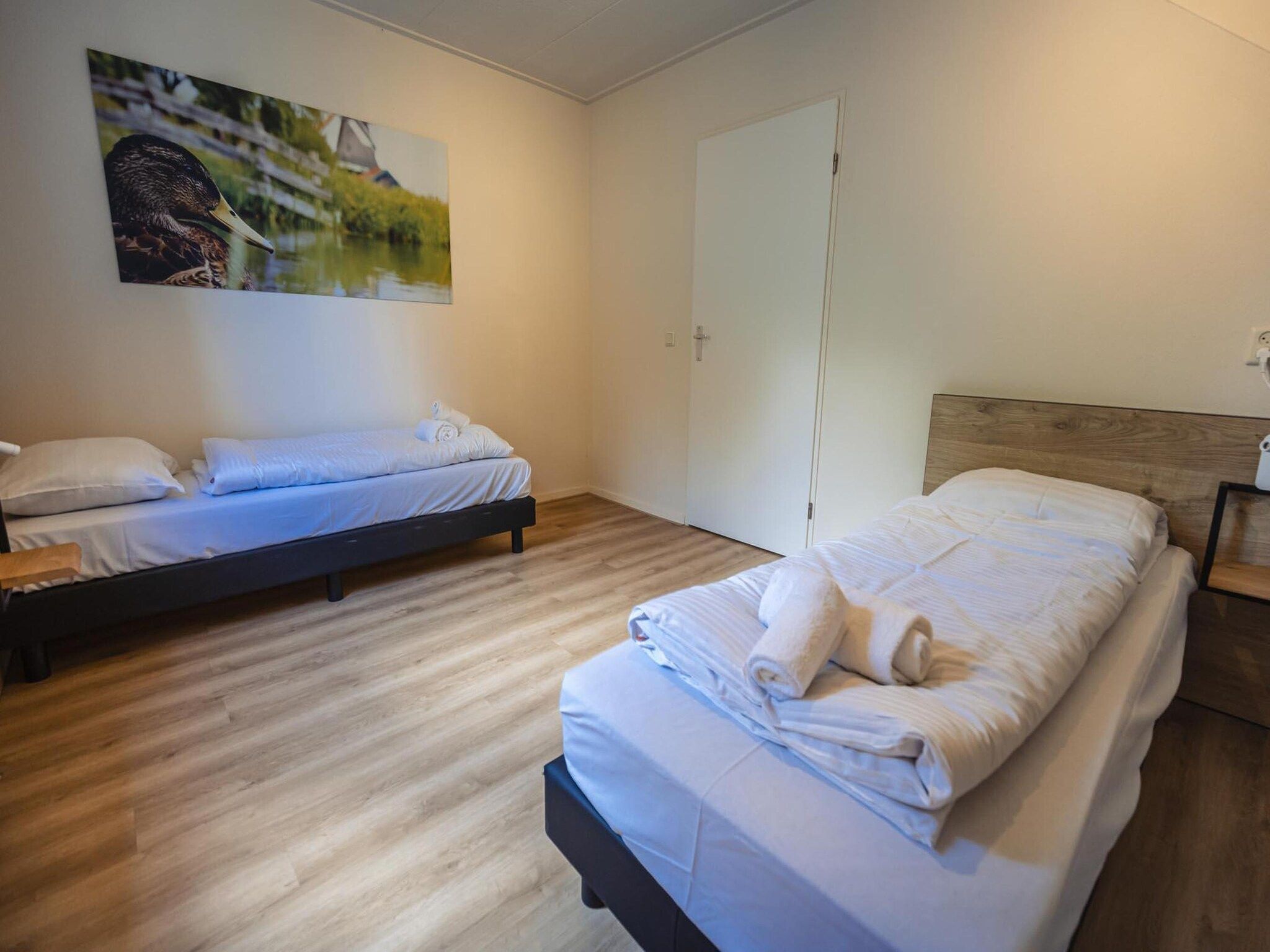 Een slaapkamer van 12 - Persons Family Bungalow in Ewijk