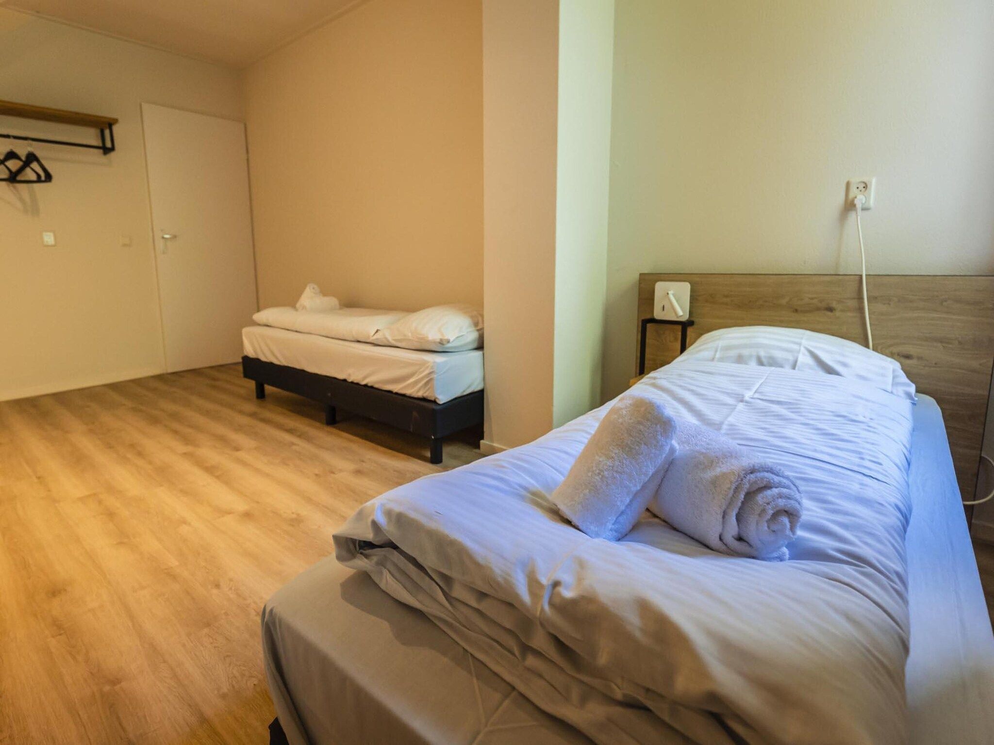 Een slaapkamer van 12 - Persons Family Bungalow in Ewijk