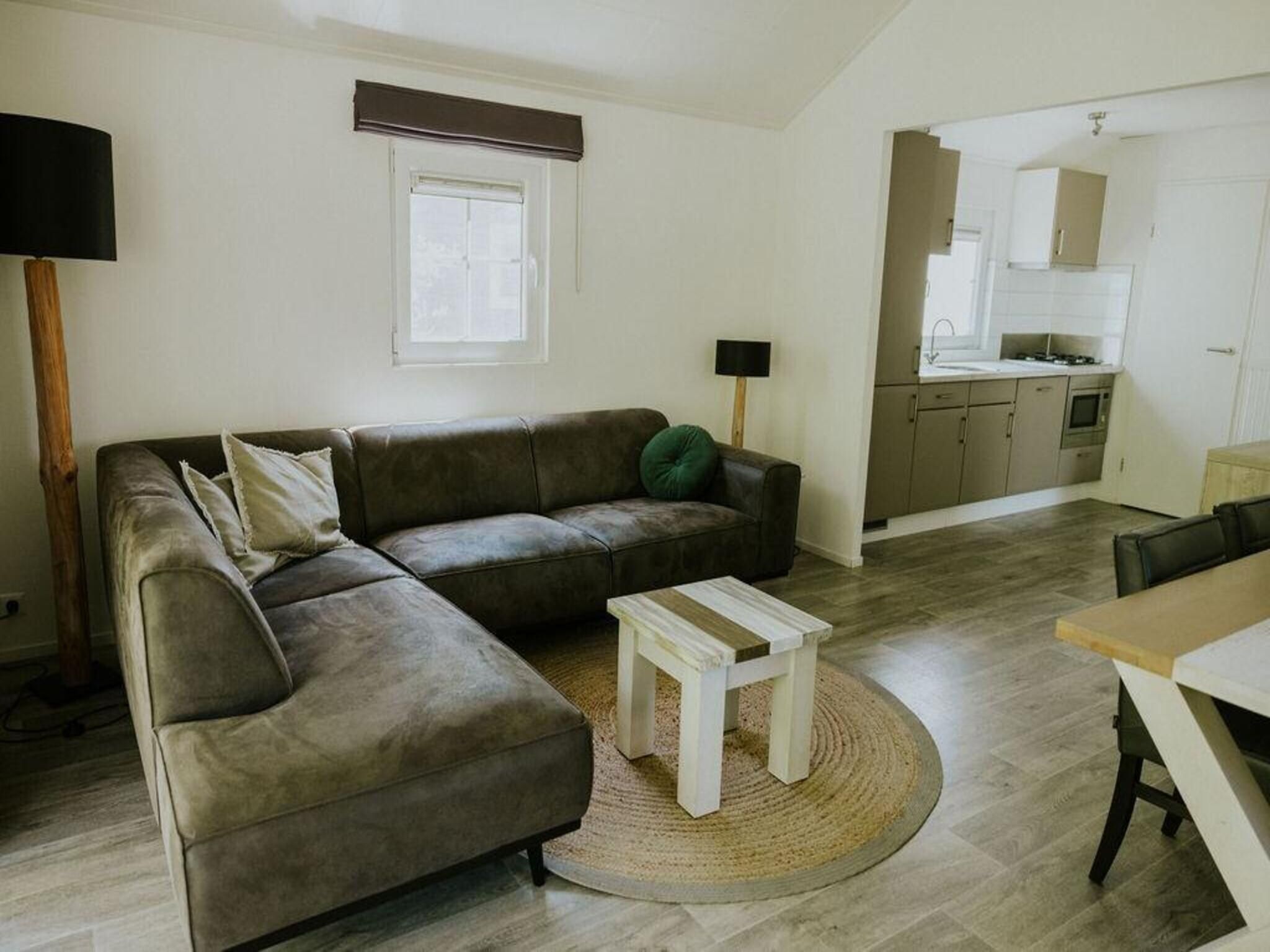 De woonkamer van Boslodge l 4 persons in Balkbrug