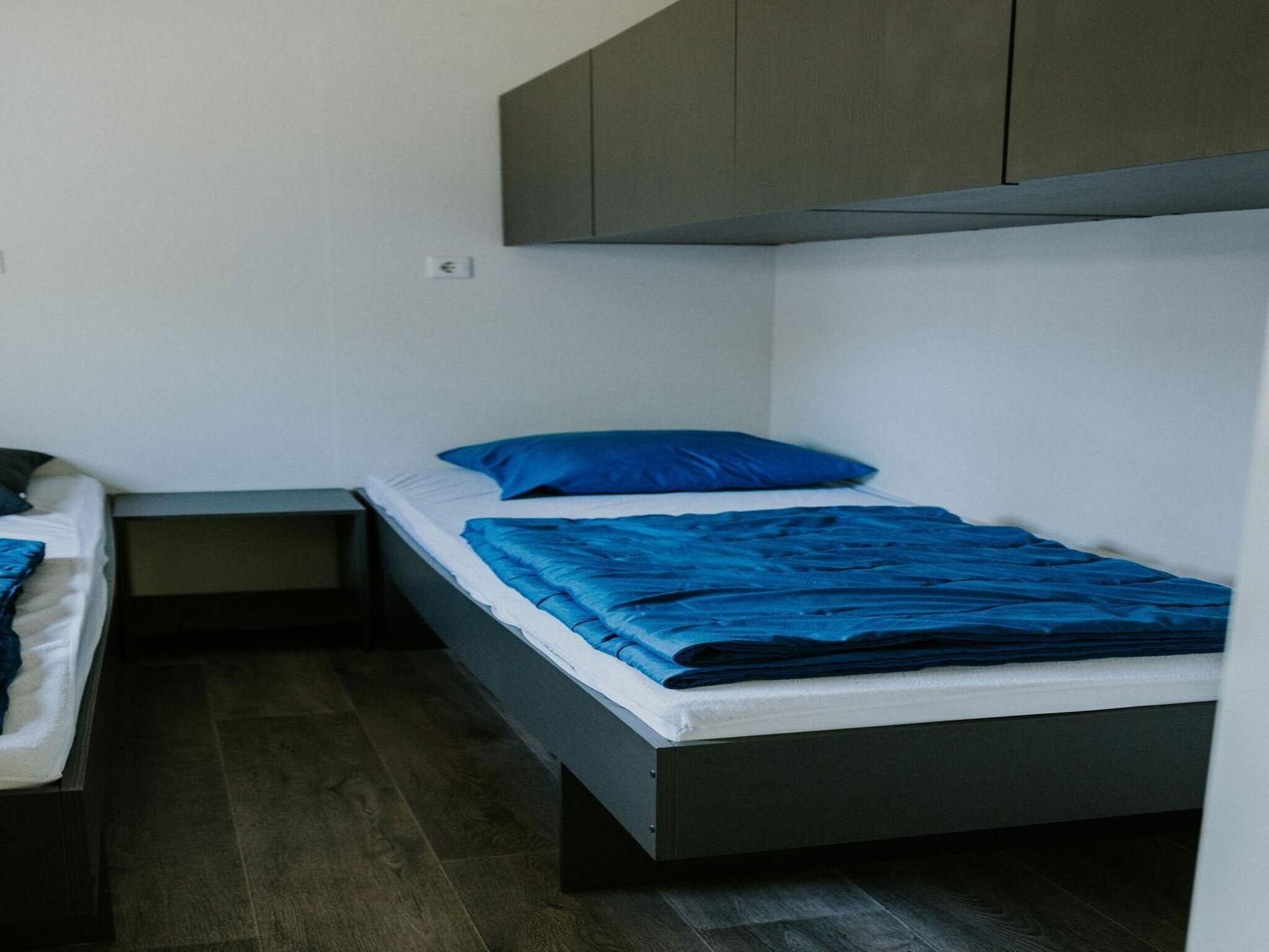 Een slaapkamer van Boslodge l 4 persons in Balkbrug