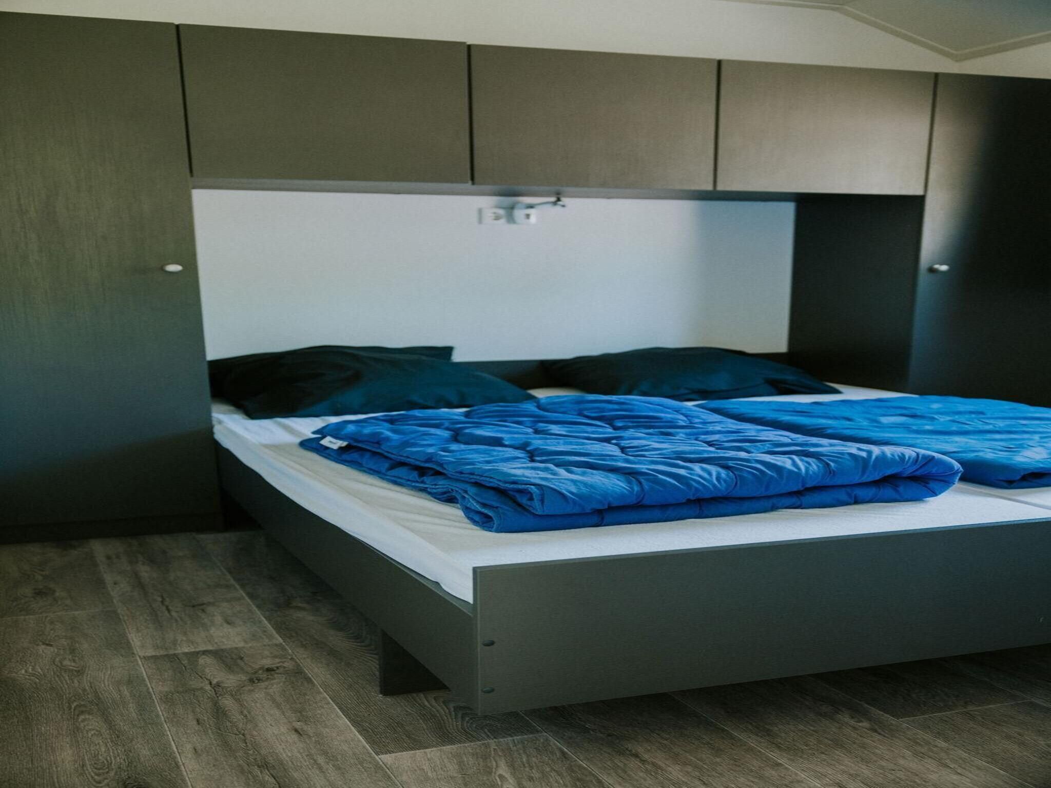 Een slaapkamer van Boslodge l 4 persons in Balkbrug