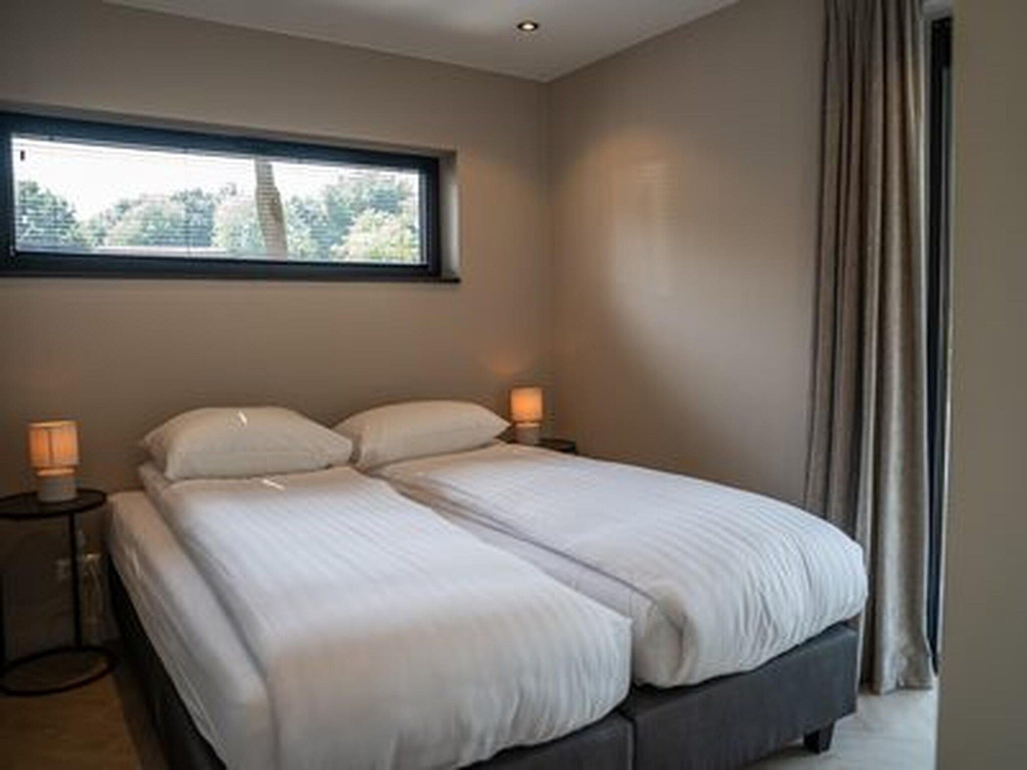 Een slaapkamer van Ecovilla Boszicht Luxe in Oirschot