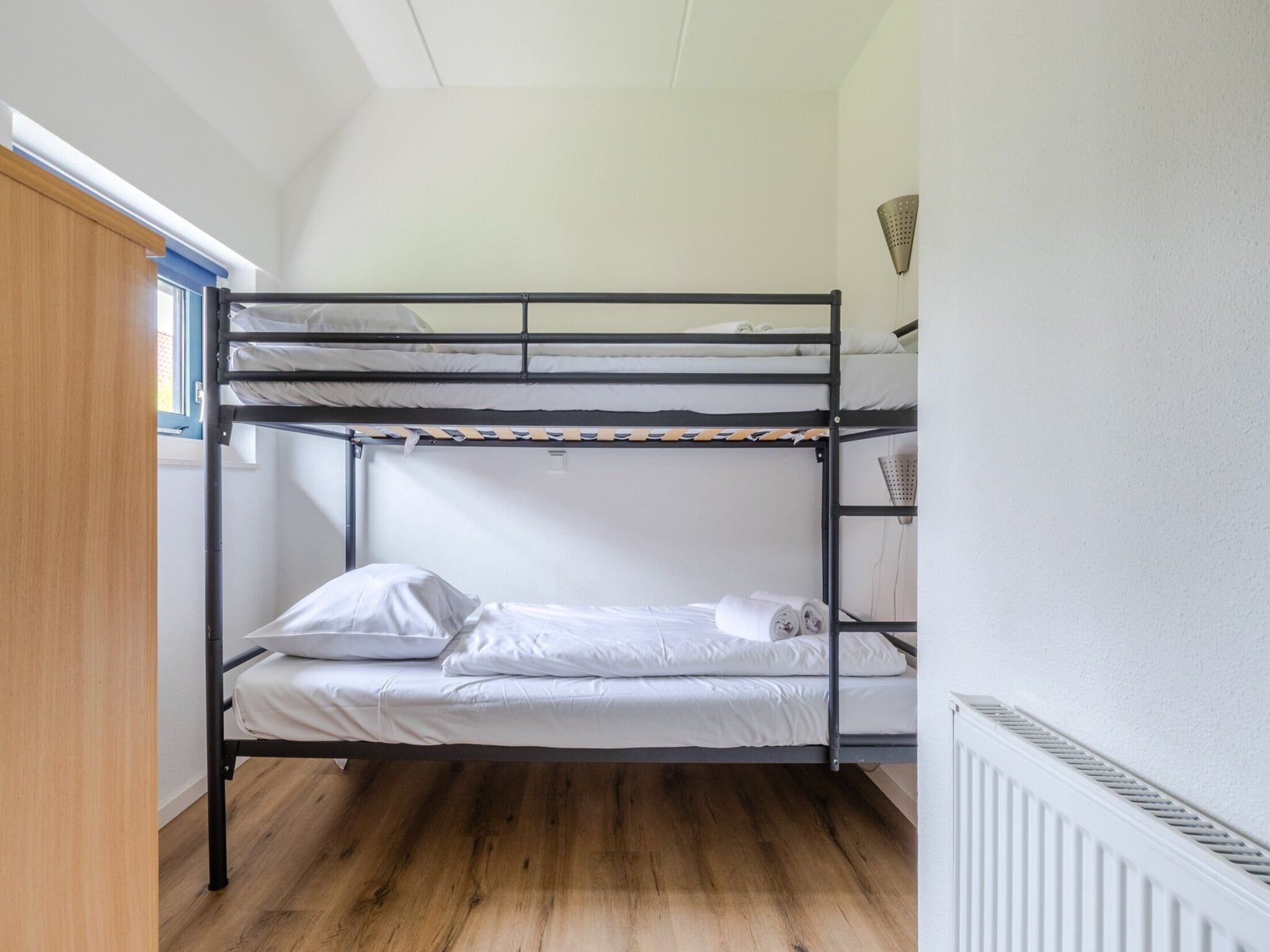 Een slaapkamer van Kustpark Texel 6 in De Koog