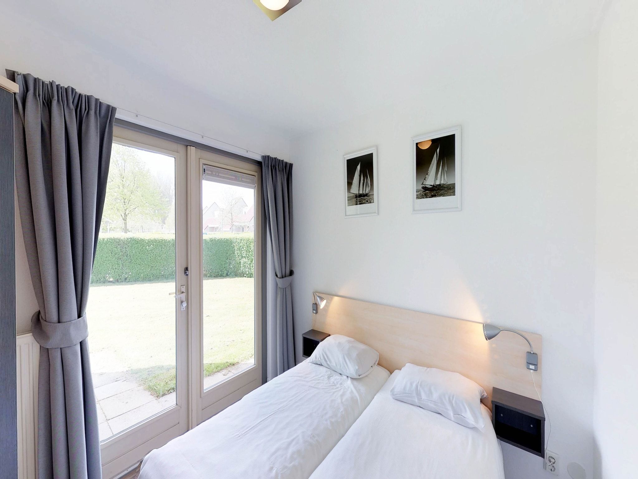 Een slaapkamer van Villapark de Paardekreek 3 in Kortgene