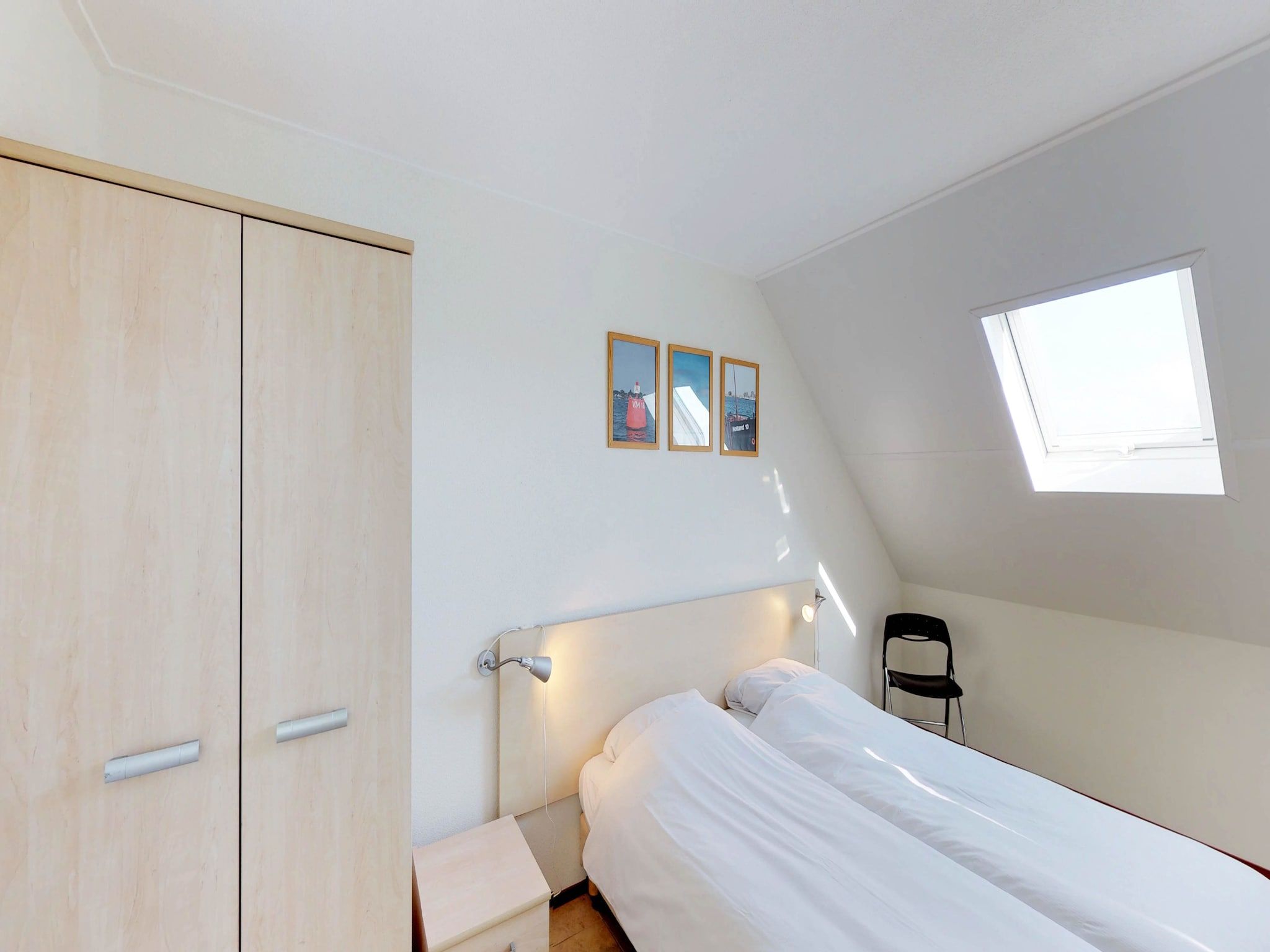 Een slaapkamer van Villapark de Paardekreek 6 in Kortgene