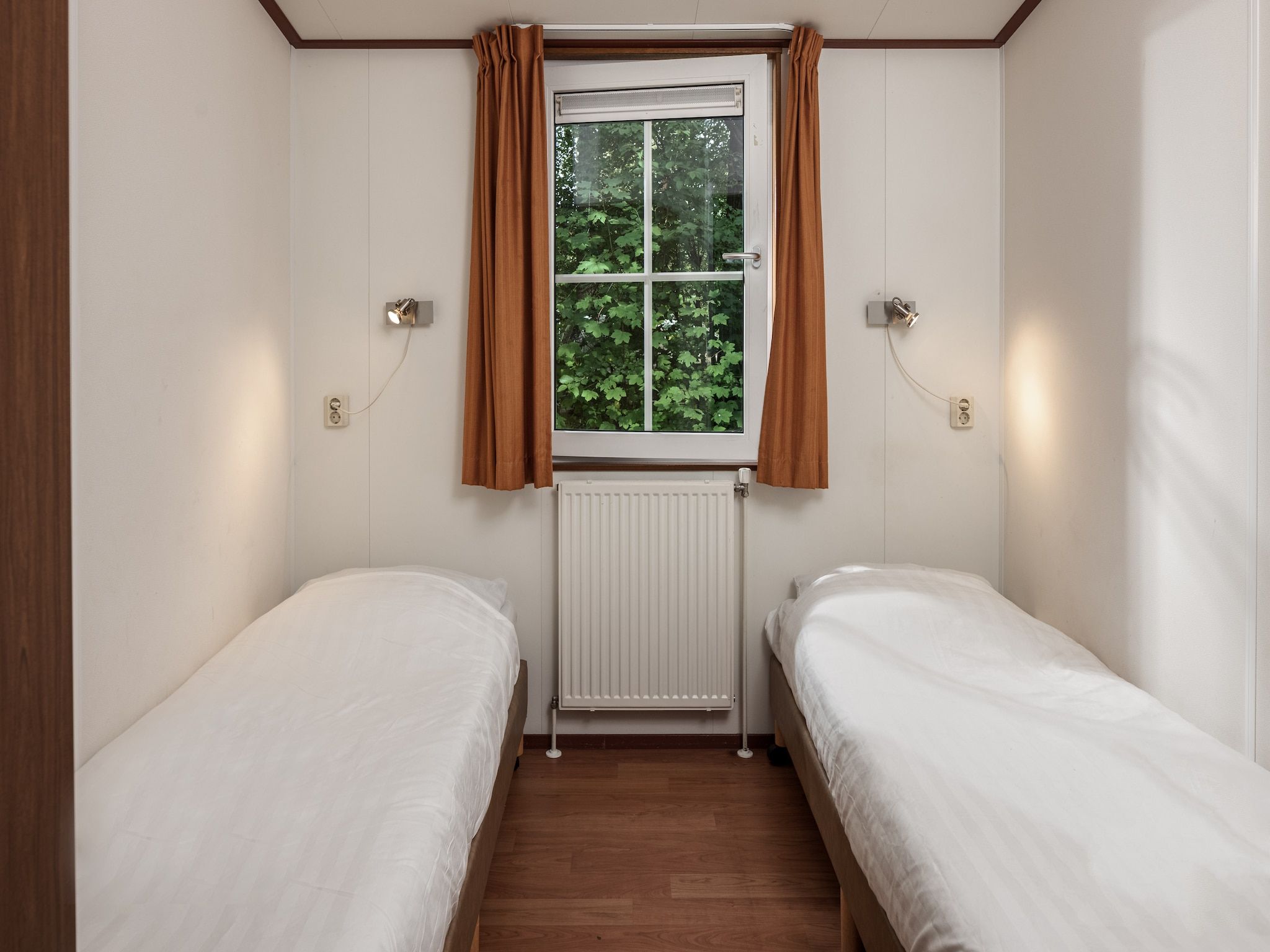 Een slaapkamer van Bospark Lunsbergen 6 in Borger