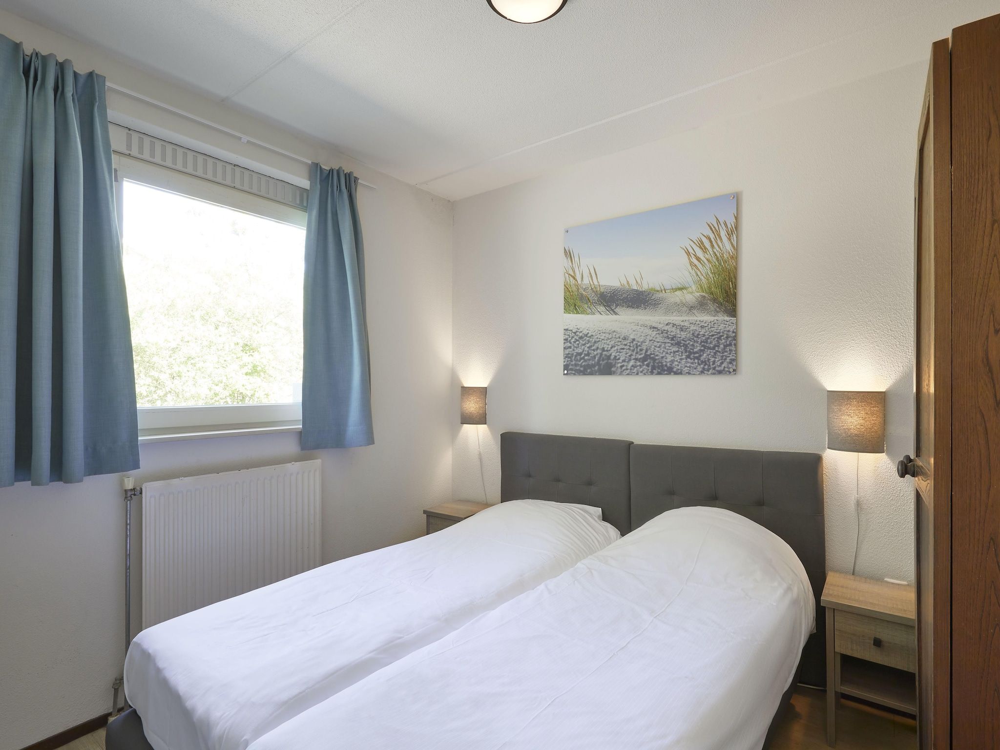 Een slaapkamer van Vakantiepark Kijkduin 2 in Den Haag