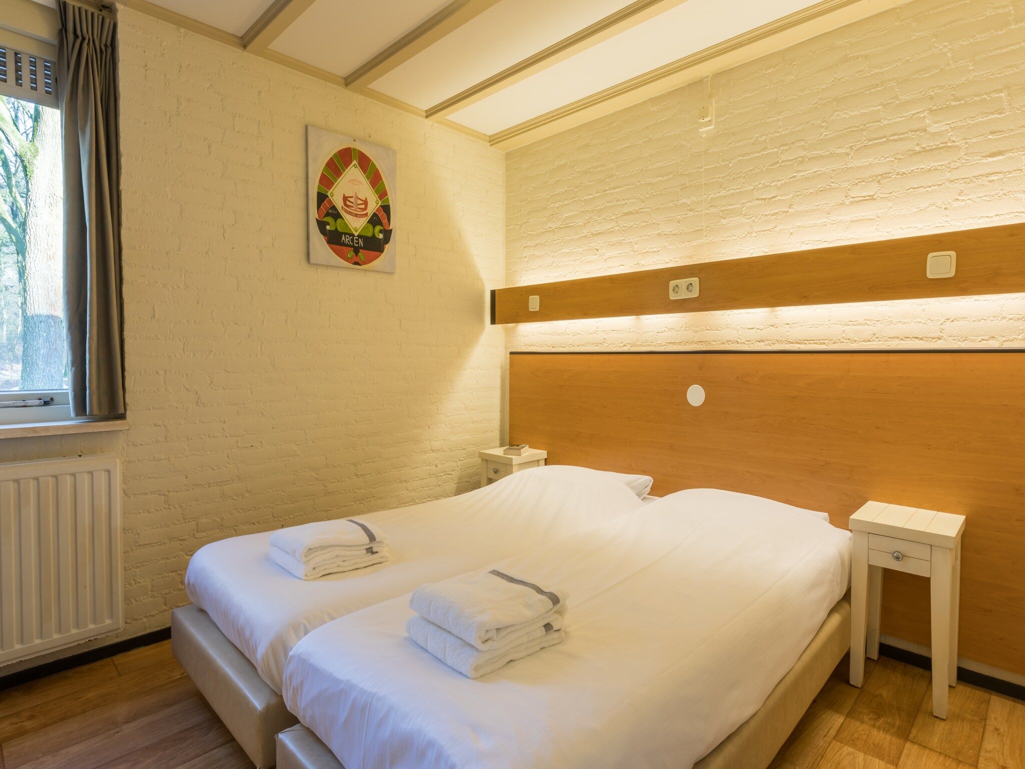 Een slaapkamer van Vakantiepark Klein Vink 15 in Arcen