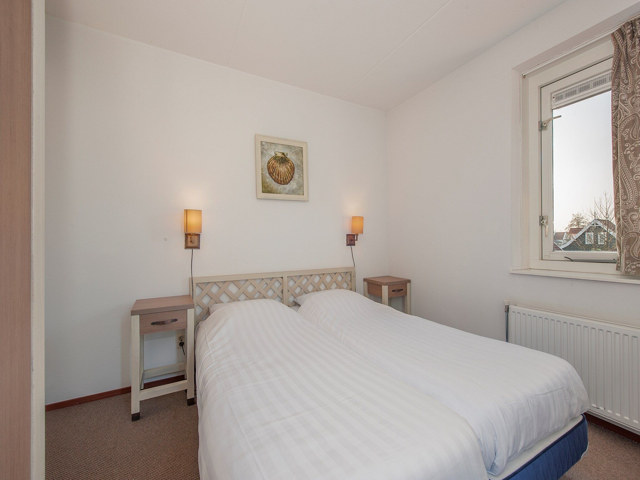 Een slaapkamer van Aquadelta 13 in Bruinisse