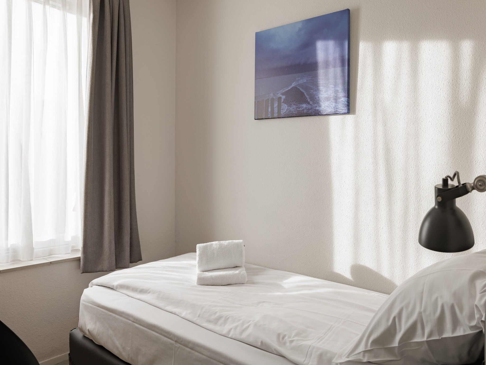 Een slaapkamer van Roompot Beach Resort 4 in Kamperland