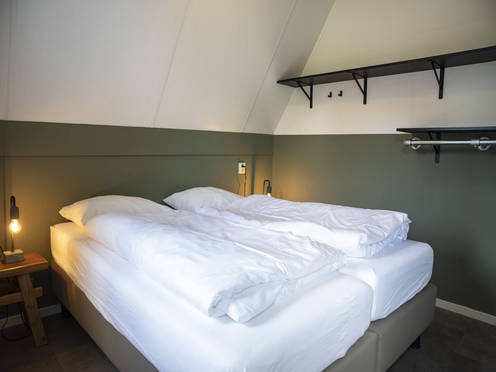 Een slaapkamer van Vakantie bij Meeussen - Molendal 1 in Plasmolen