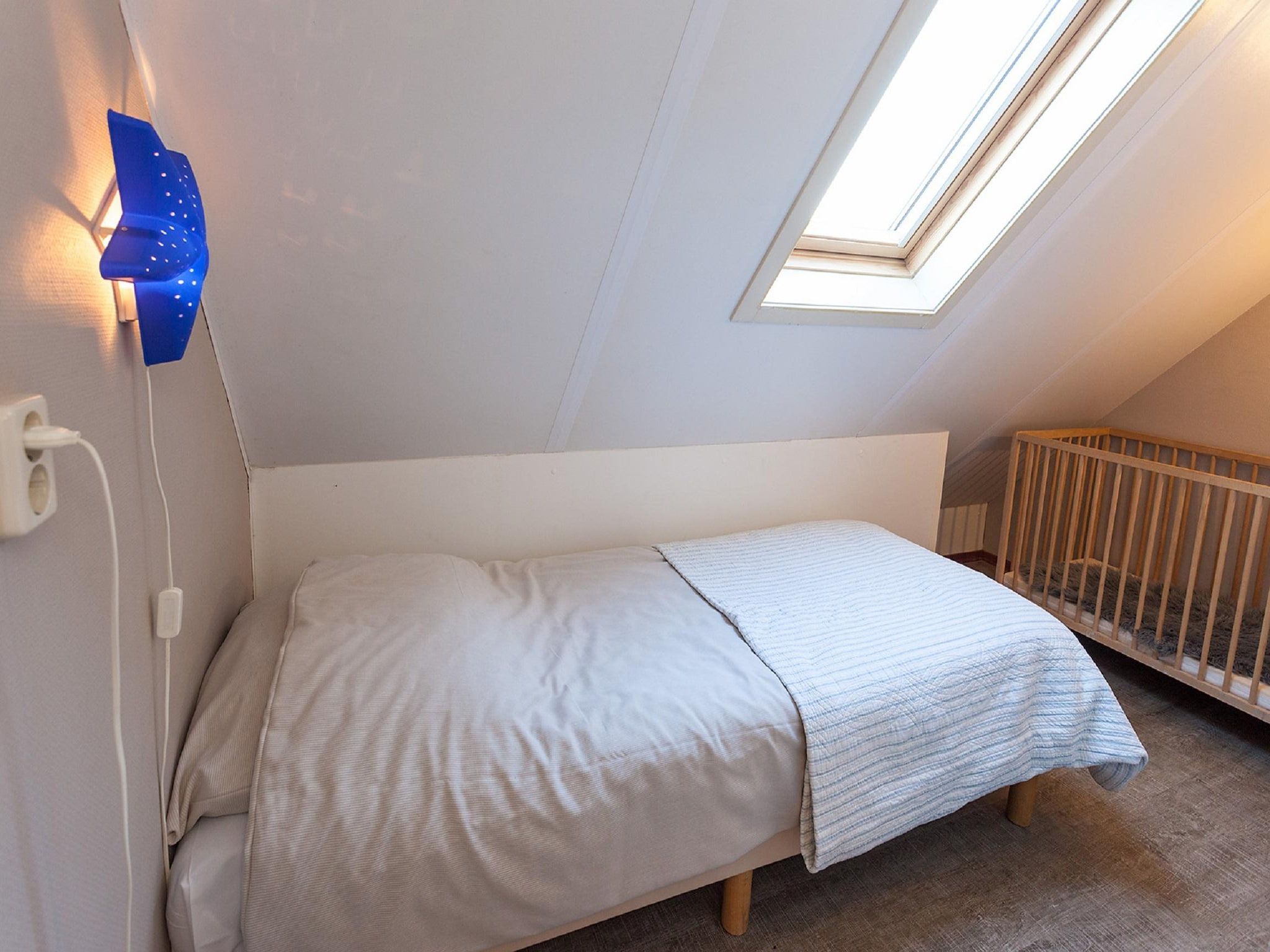 Een slaapkamer van Villavakantiepark IJsselhof 5 in Andijk