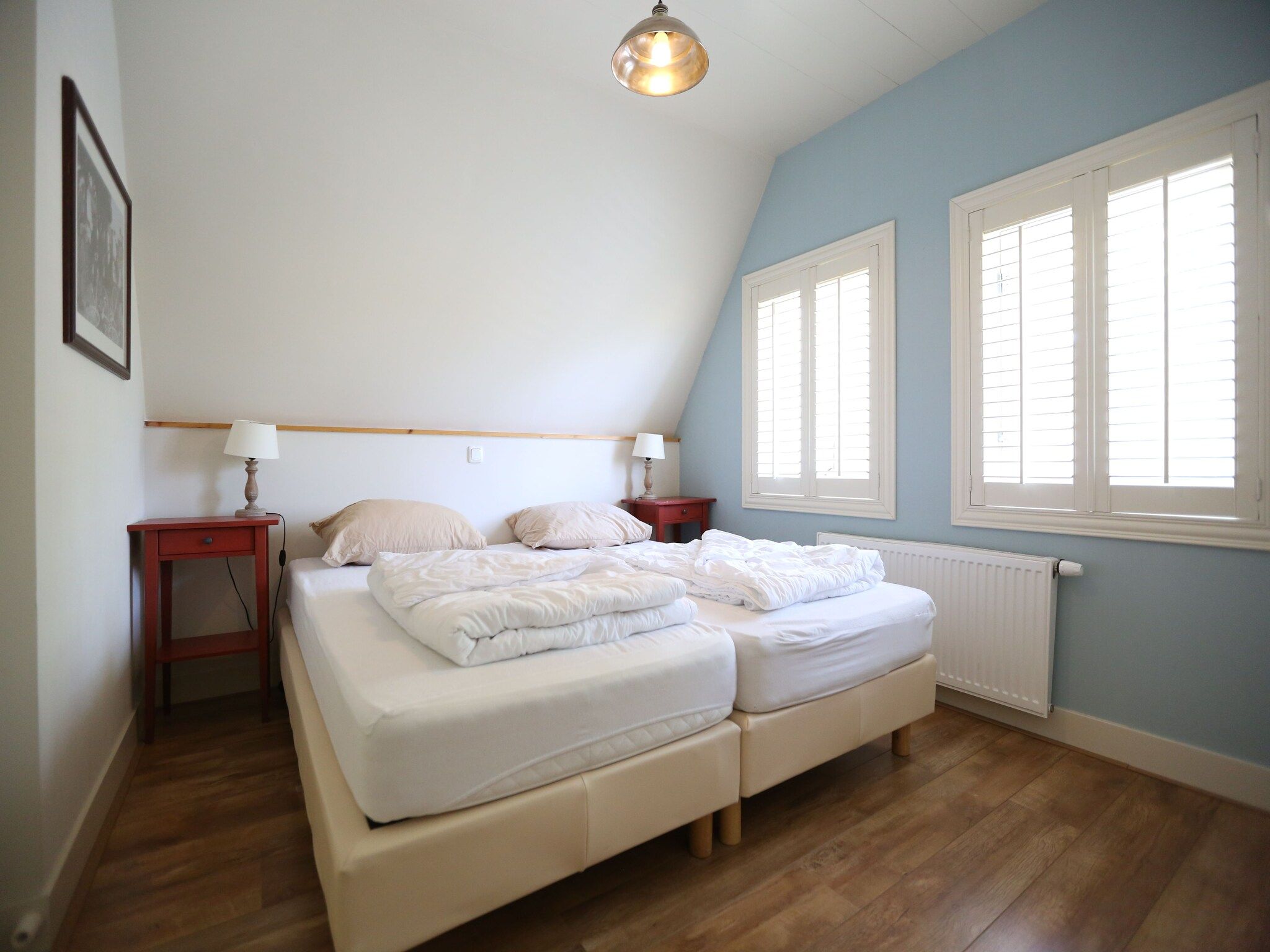 Een slaapkamer van Recreatiepark Wiringherlant  - Villa 4 in Hippolytushoef