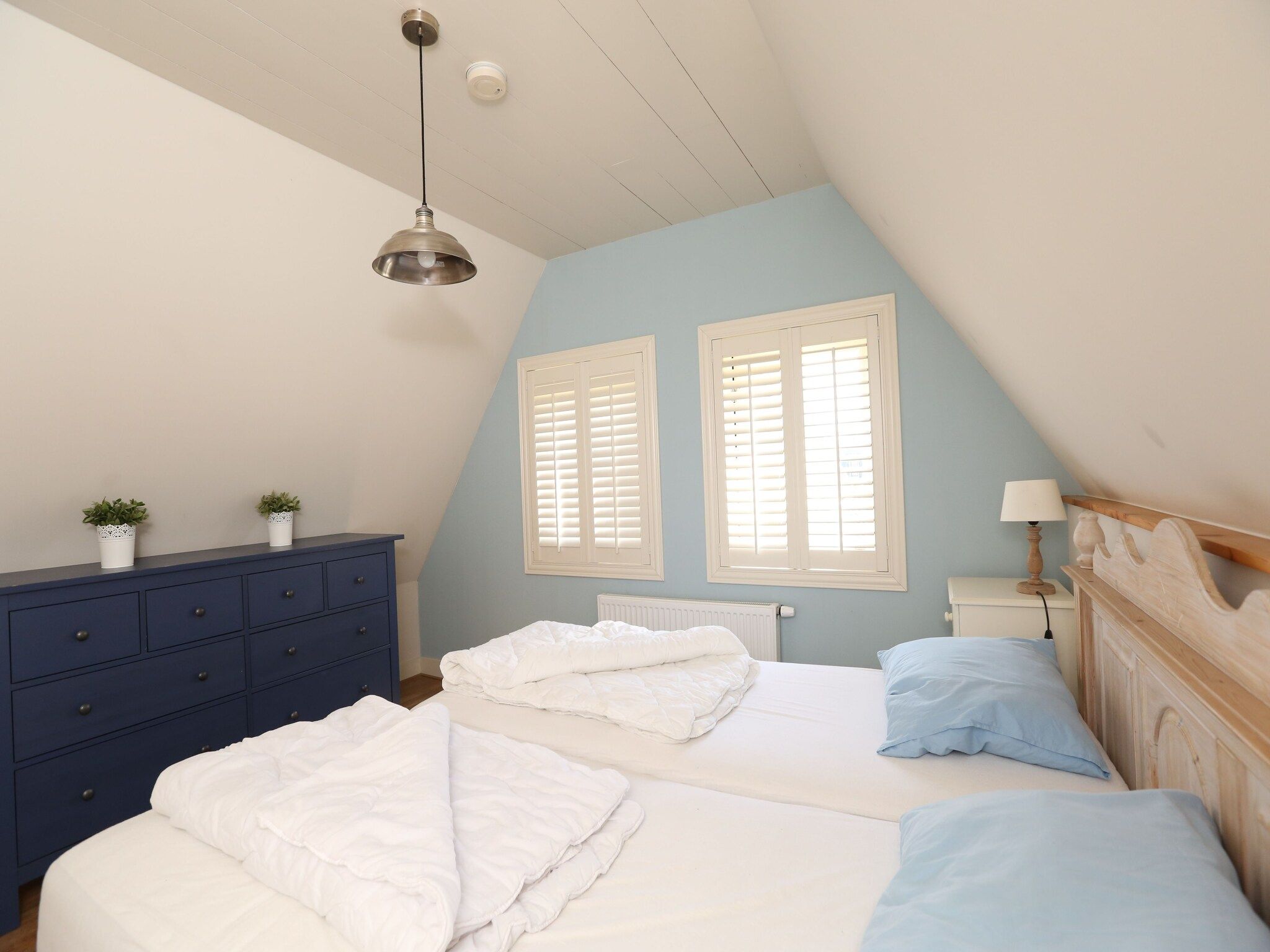 Een slaapkamer van Recreatiepark Wiringherlant  - Villa 4 in Hippolytushoef