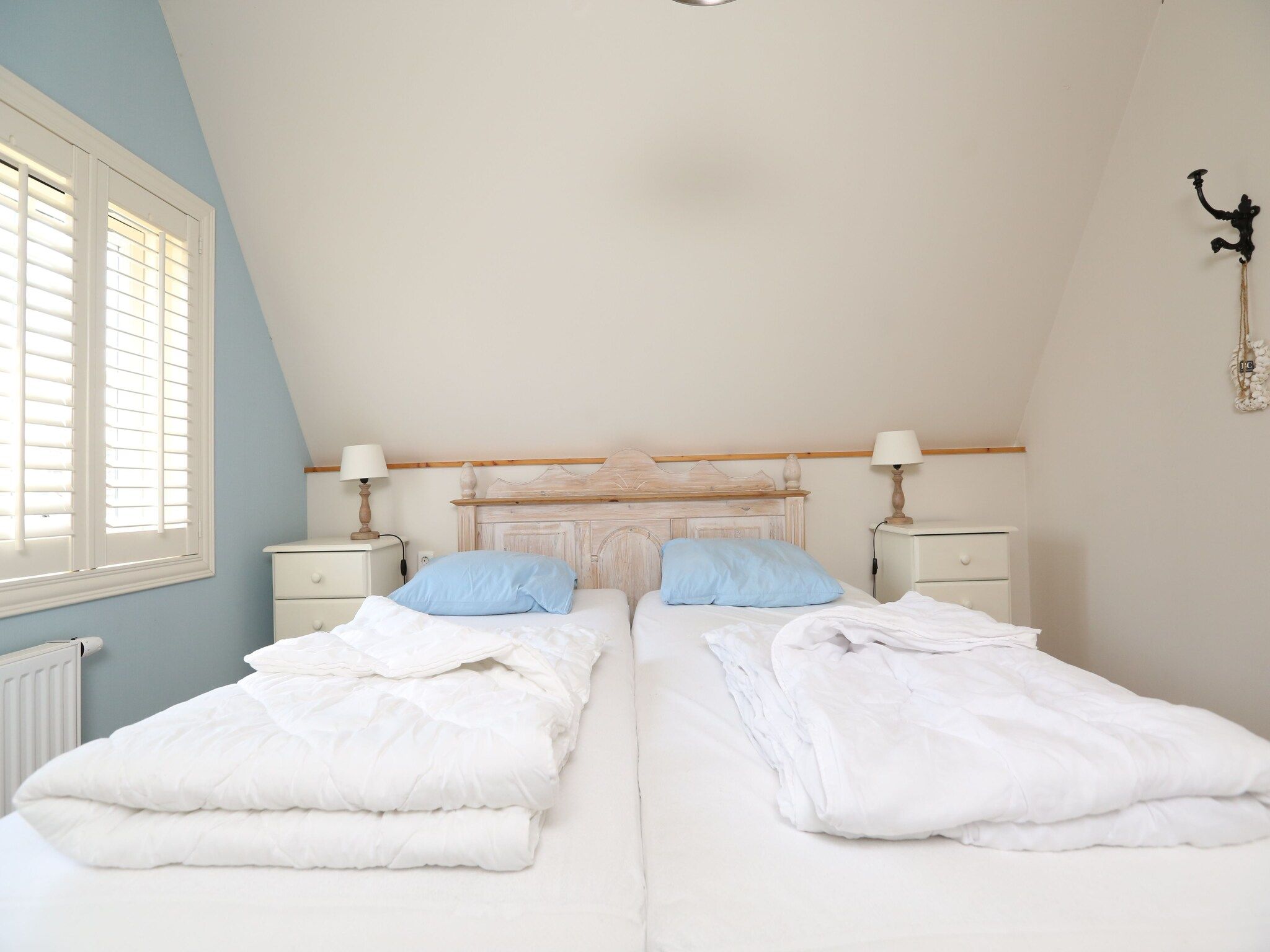 Een slaapkamer van Recreatiepark Wiringherlant  - Villa 4 in Hippolytushoef