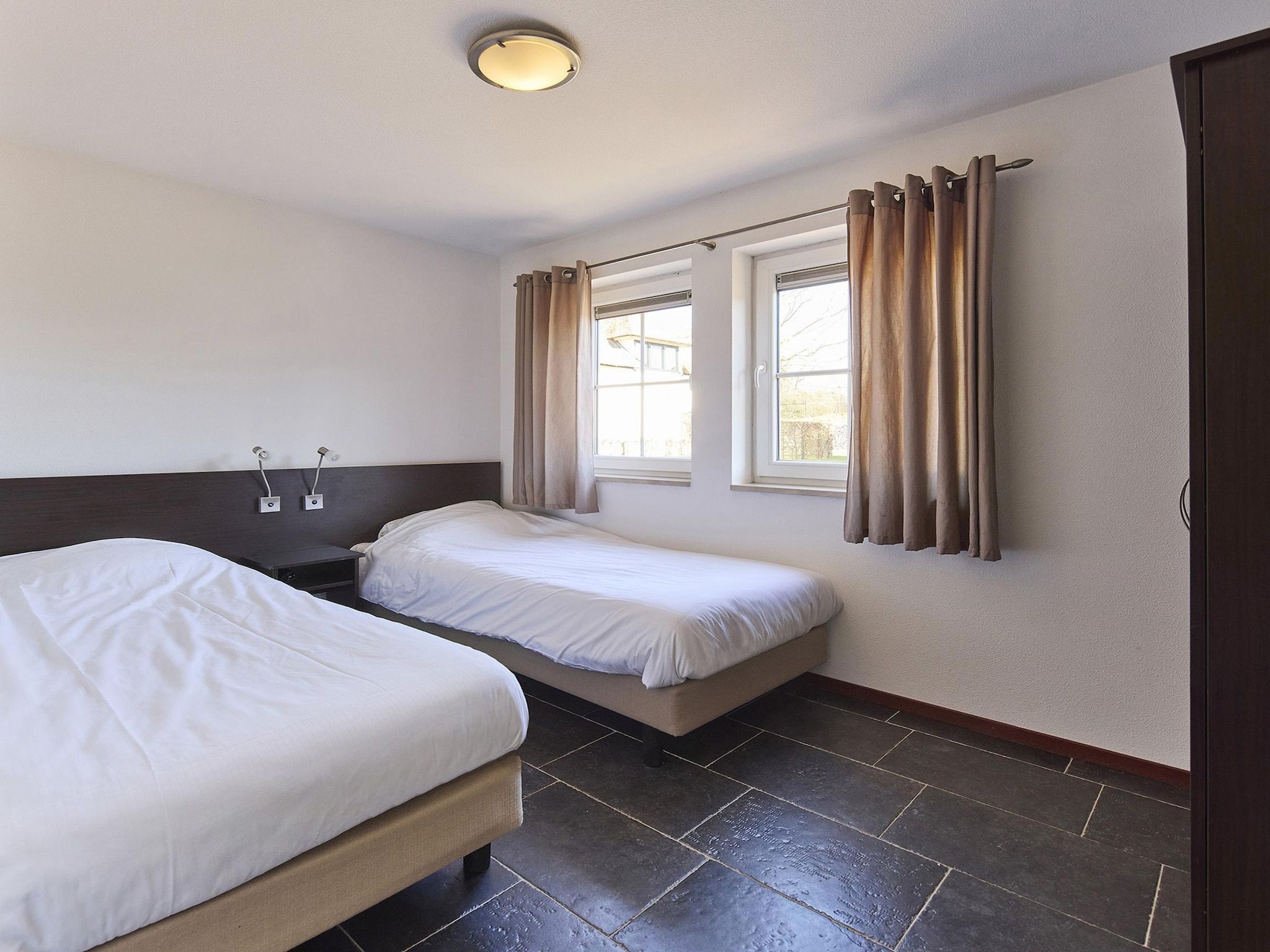 Een slaapkamer van Buitenhof De Leistert 7 in Roggel
