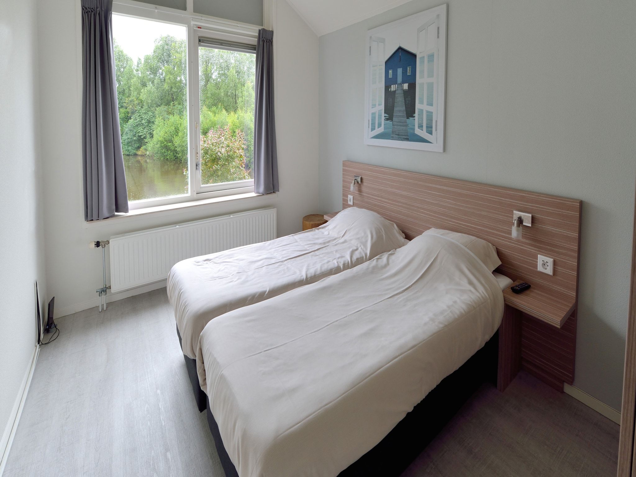 Een slaapkamer van Villapark Schildmeer 1 in Steendam