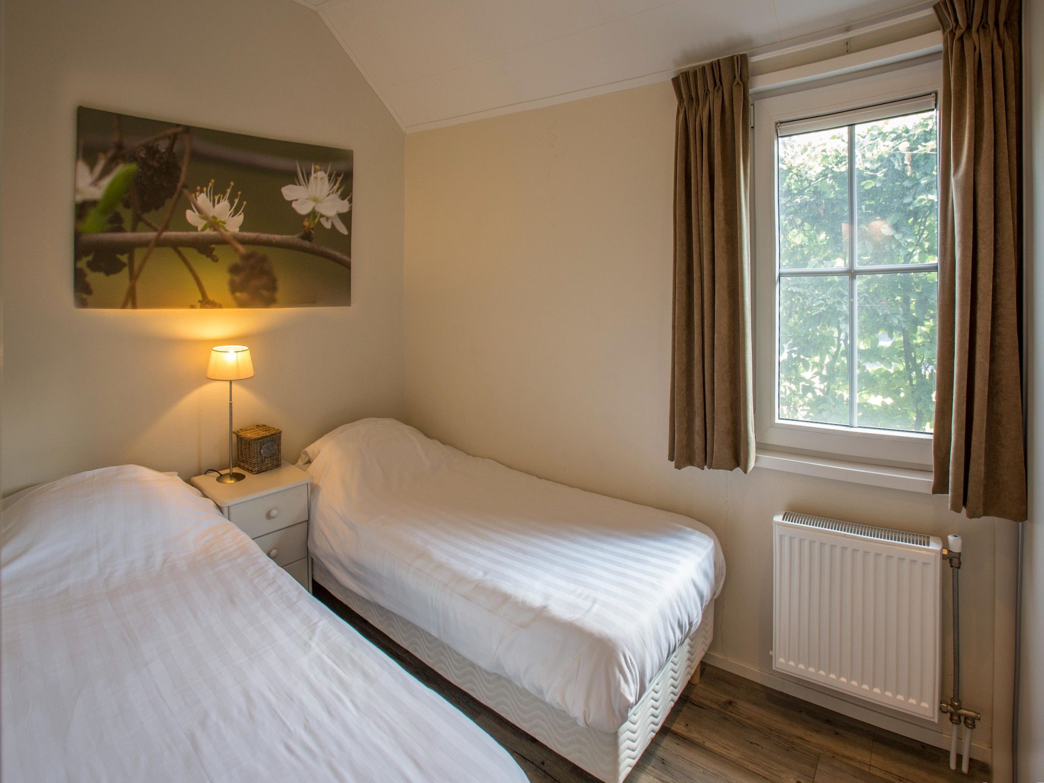 Een slaapkamer van Recreatiepark Tolplas 1 in Hoge Hexel