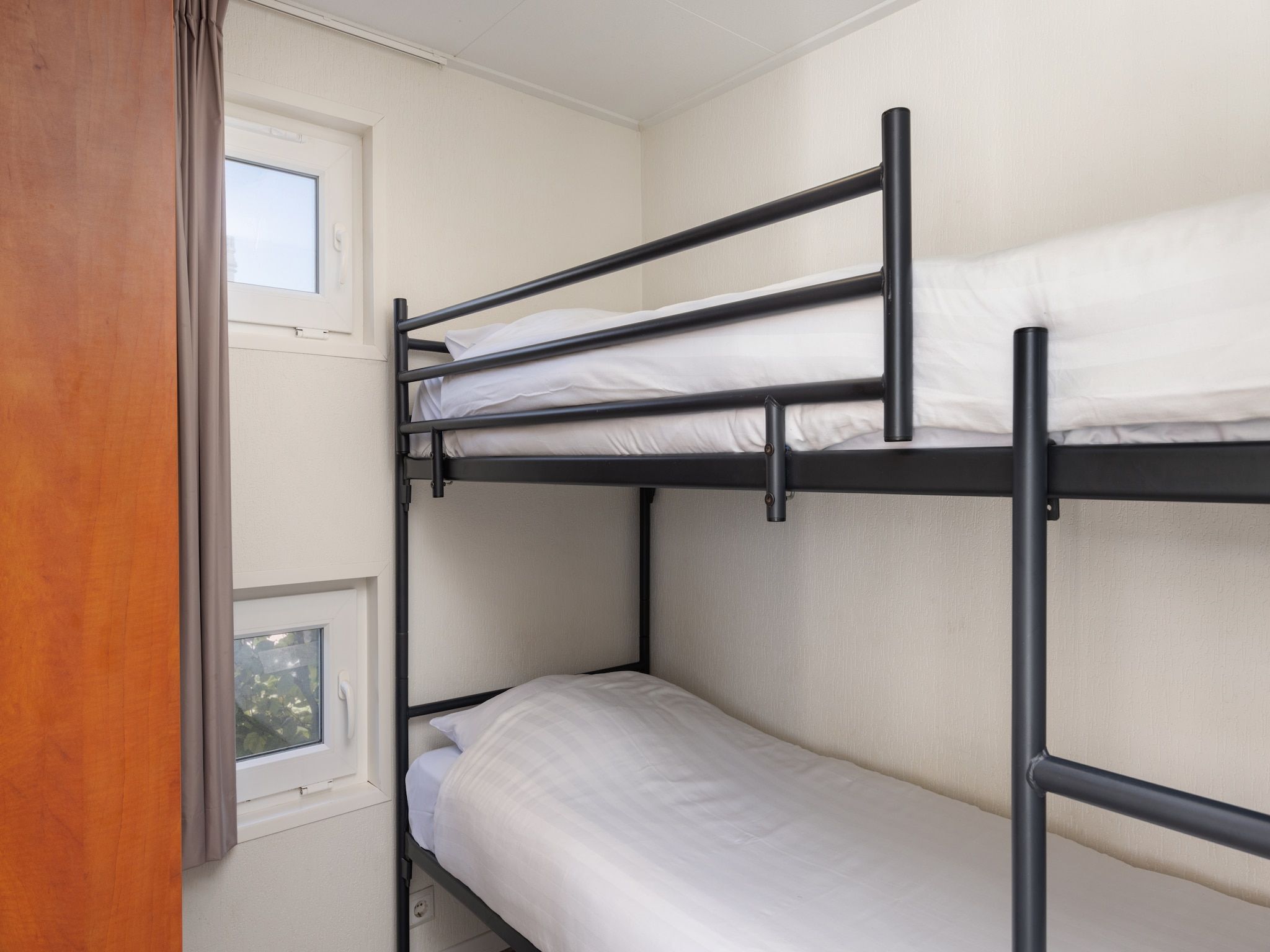 Een slaapkamer van Recreatiepark Tolplas 7 in Hoge Hexel