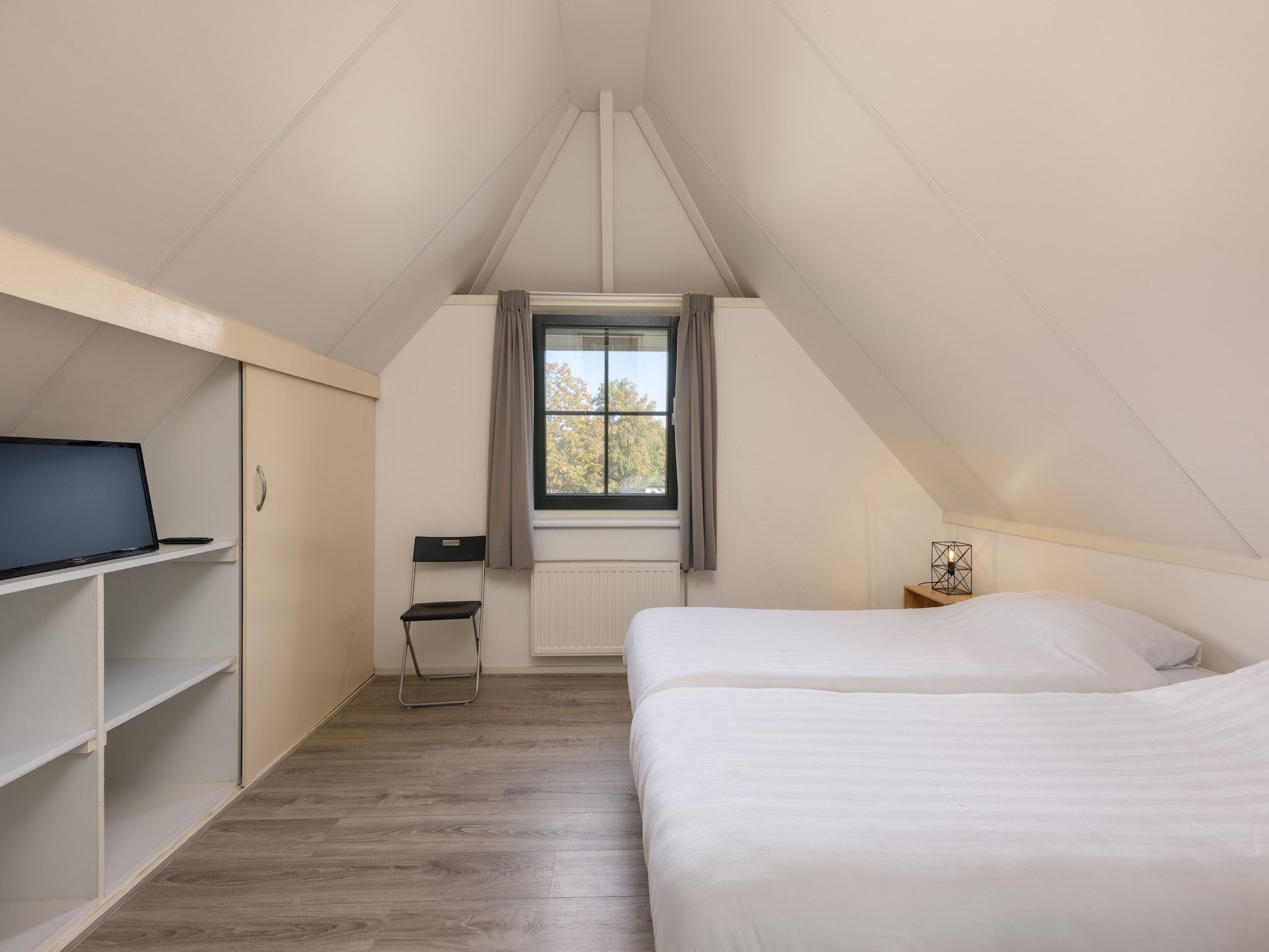 Een slaapkamer van Recreatiepark Tolplas 8 in Hoge Hexel