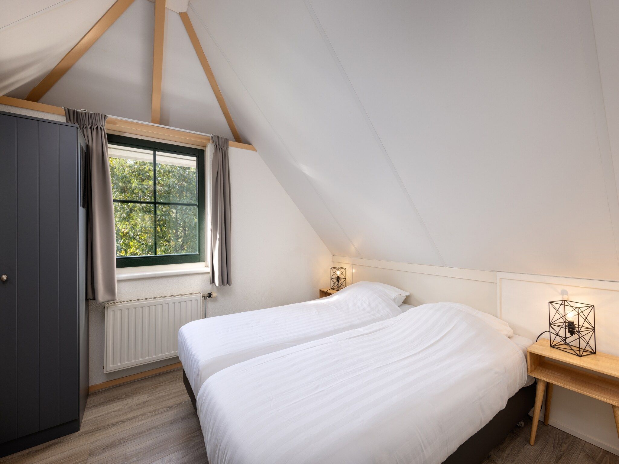 Een slaapkamer van Recreatiepark Tolplas 8 in Hoge Hexel