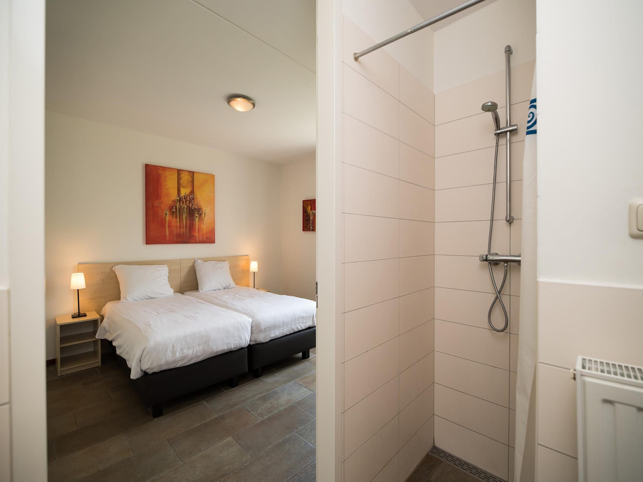 Een slaapkamer van Tuinvilla 2-6 persoons in Heel