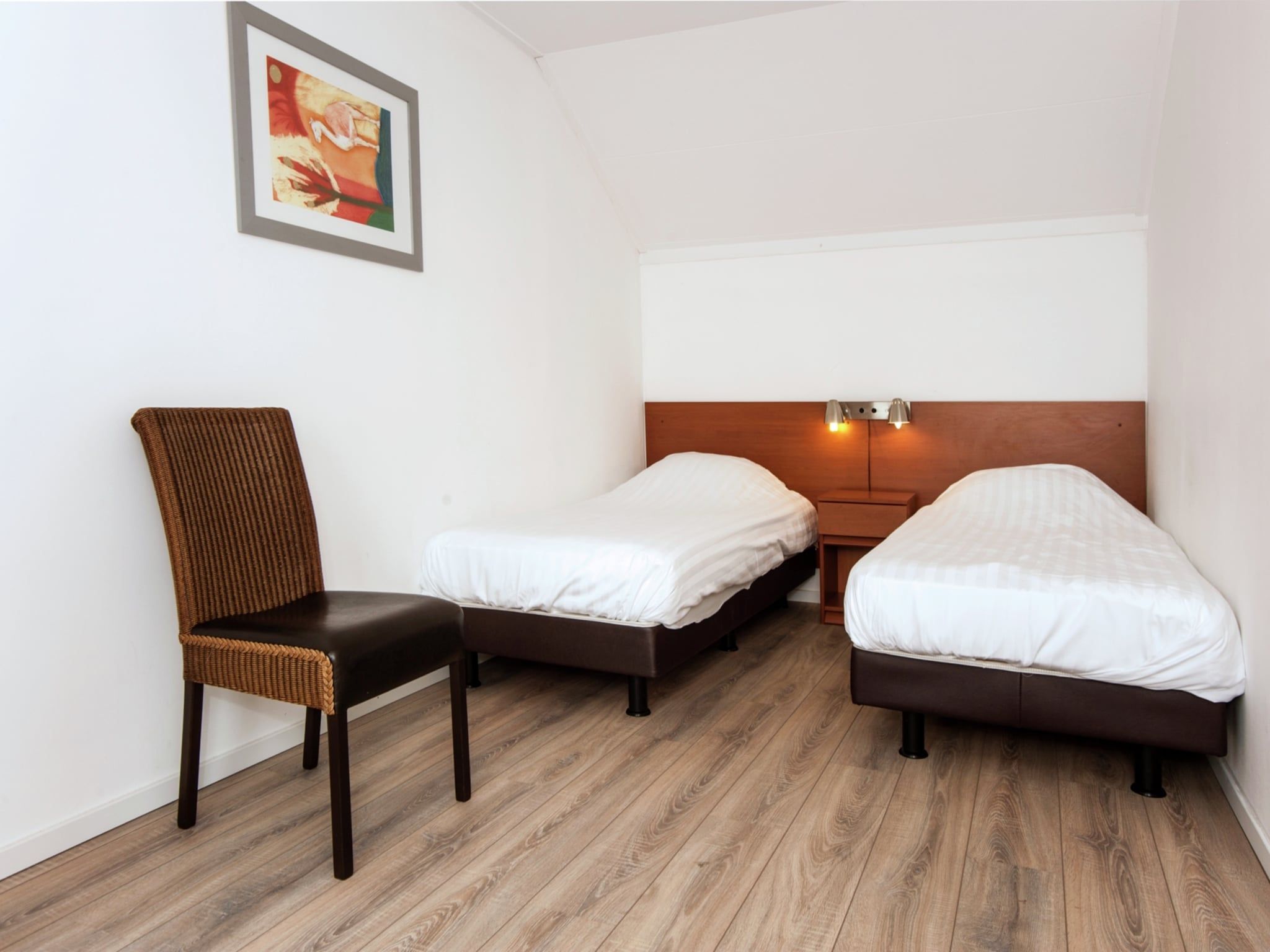 Een slaapkamer van Tuinvilla 2-4 persoons in Heel