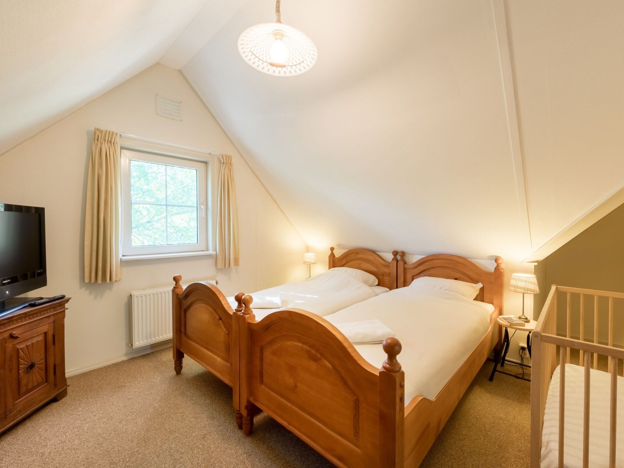 Een slaapkamer van Villapark De Weerribben 4 in Paasloo