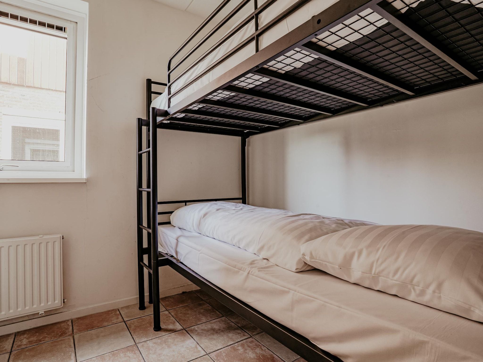 Een slaapkamer van Waterpark de Meerparel 7 in Uitgeest