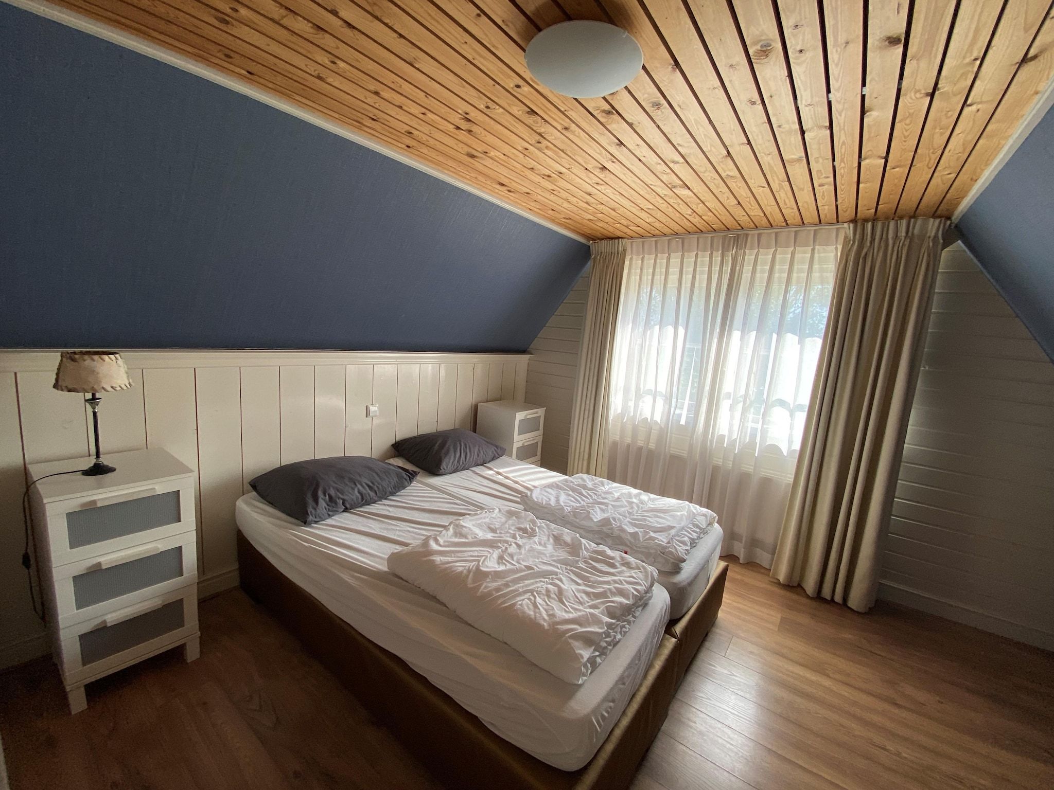 Een slaapkamer van Recreatiepark Wiringherlant - Ons Huys in Hippolytushoef