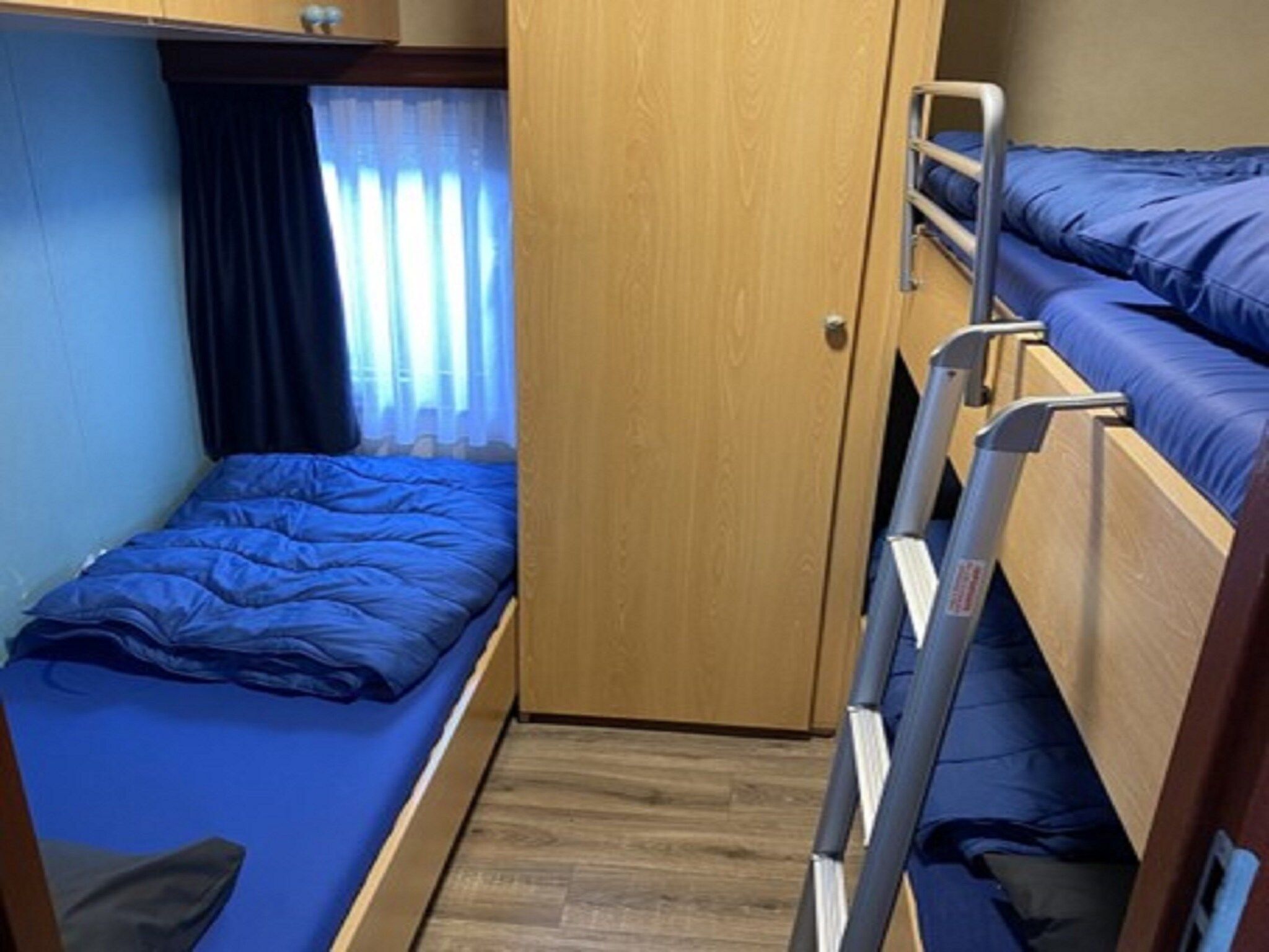 Een slaapkamer van Recreatiepark Duinhoeve 1 in Udenhout