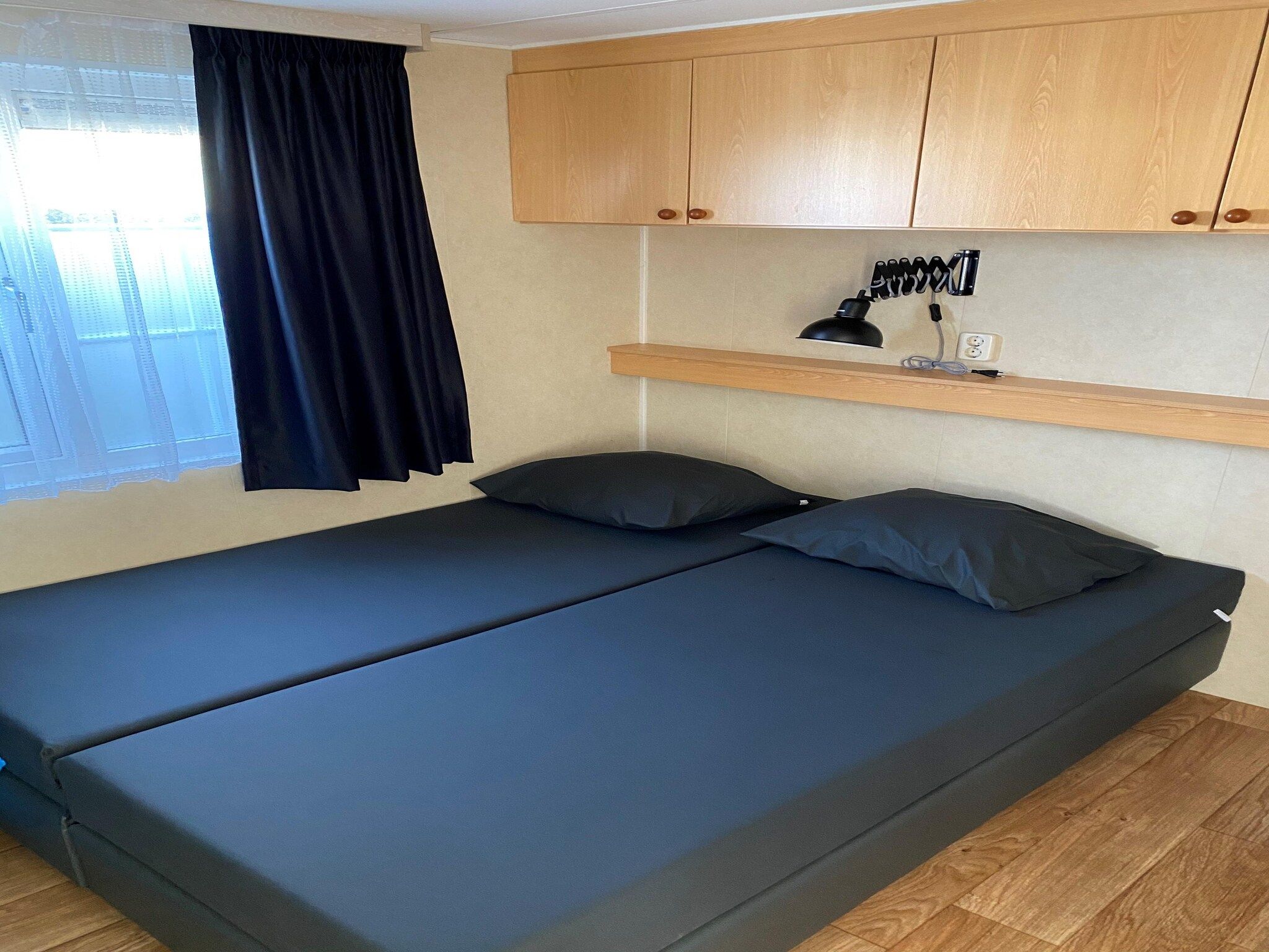 Een slaapkamer van Recreatiepark Duinhoeve 1 in Udenhout