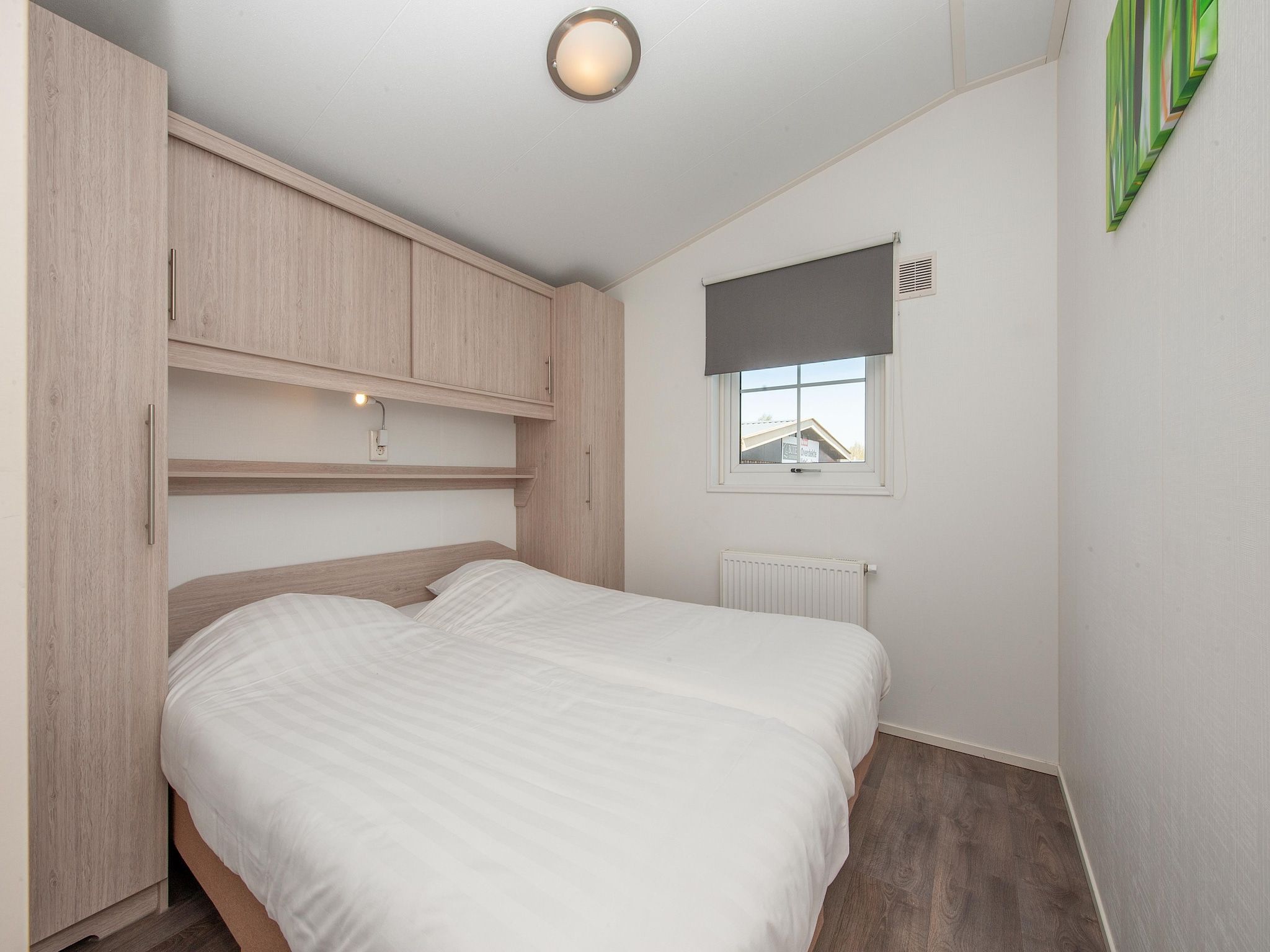 Een slaapkamer van Vakantiepark Giethoorn 4 in Giethoorn