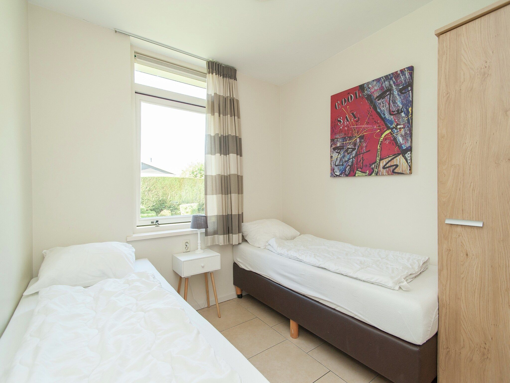 Een slaapkamer van Bungalowpark de Gouden Spar 2 in Noordwijk