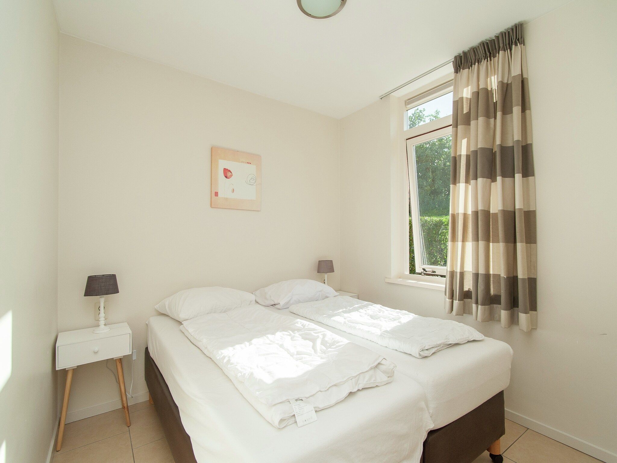 Een slaapkamer van Bungalowpark de Gouden Spar 2 in Noordwijk