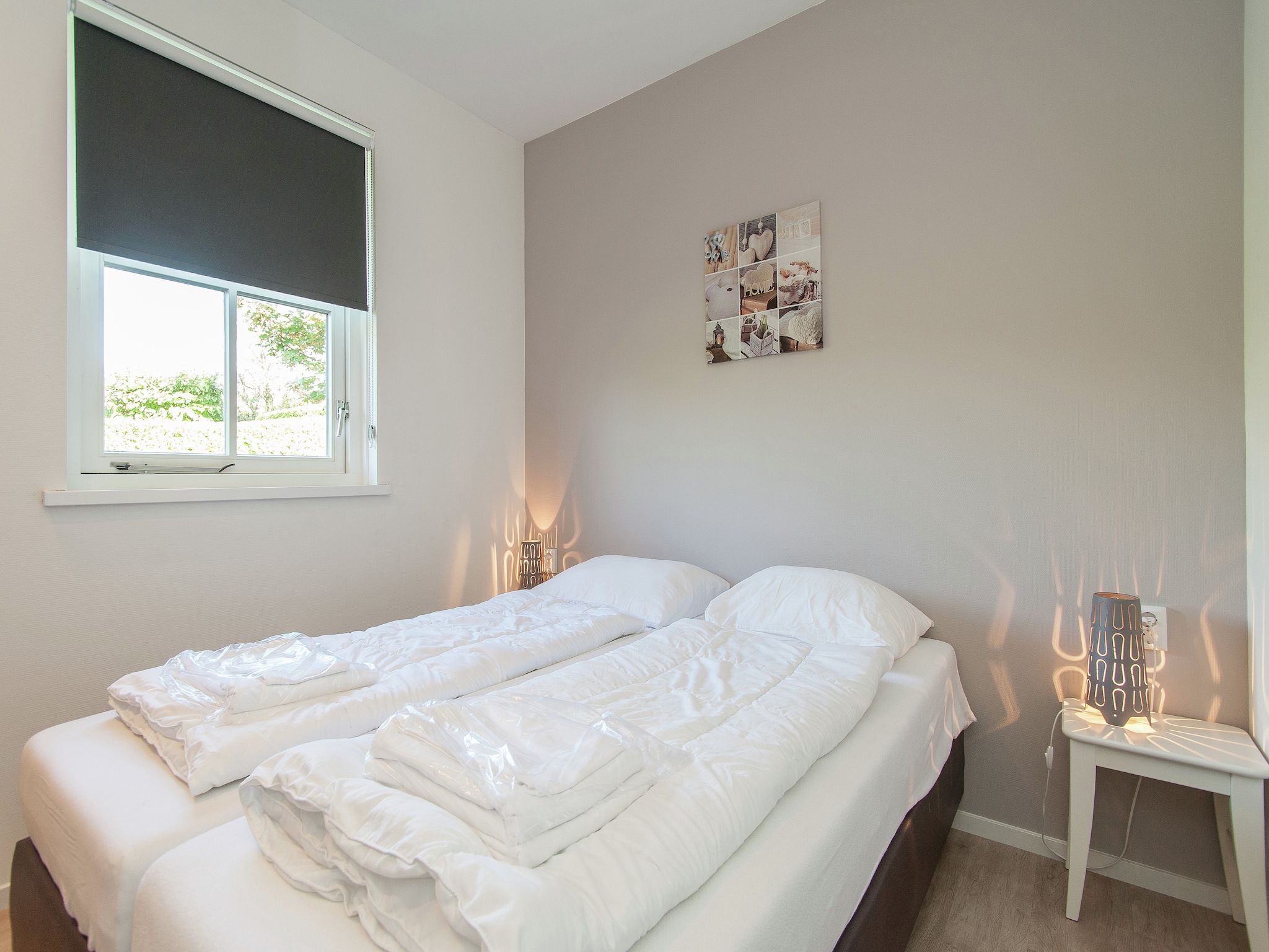 Een slaapkamer van Bungalowpark de Gouden Spar 3 in Noordwijk