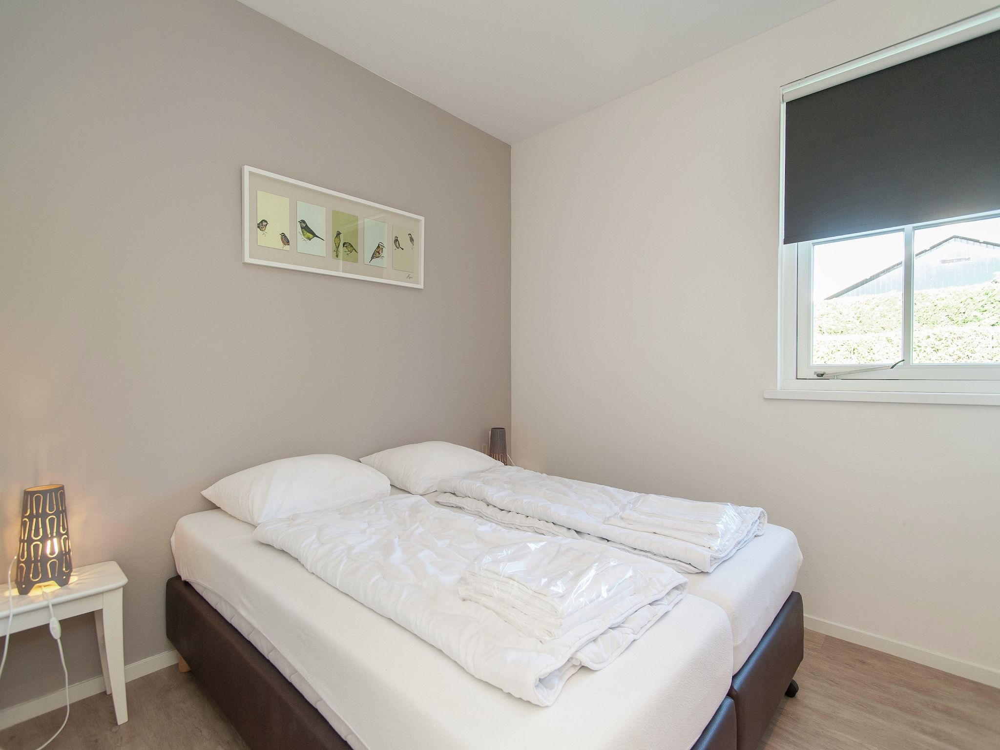 Een slaapkamer van Bungalowpark de Gouden Spar 3 in Noordwijk