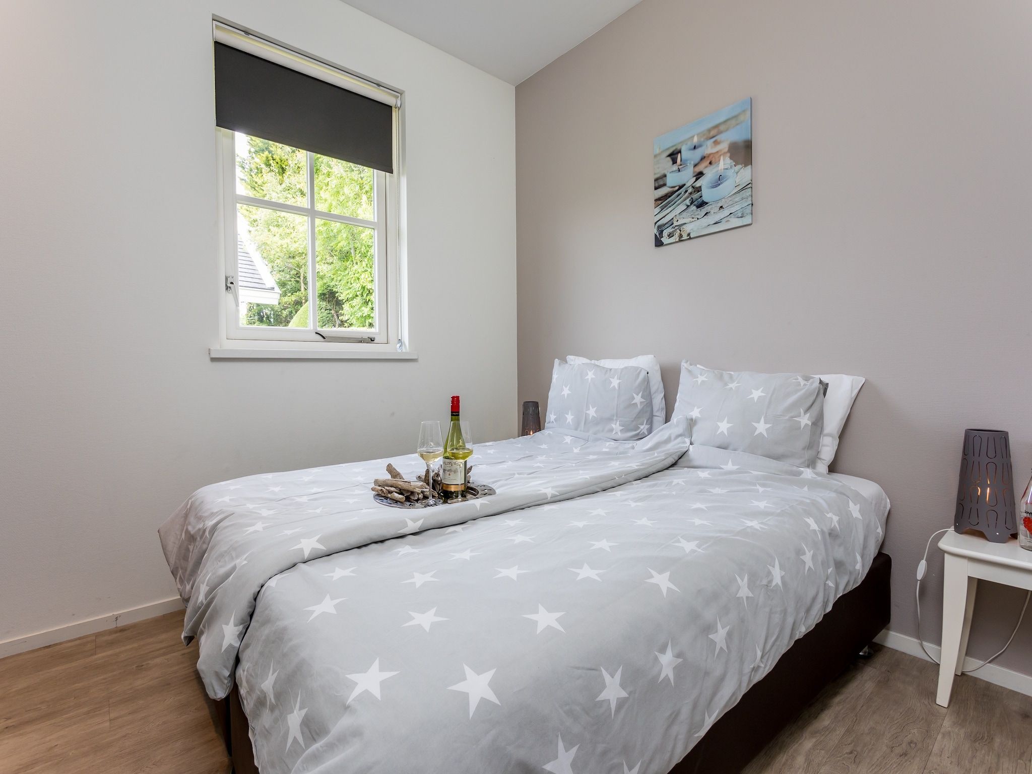 Een slaapkamer van Bungalowpark de Gouden Spar 3 in Noordwijk