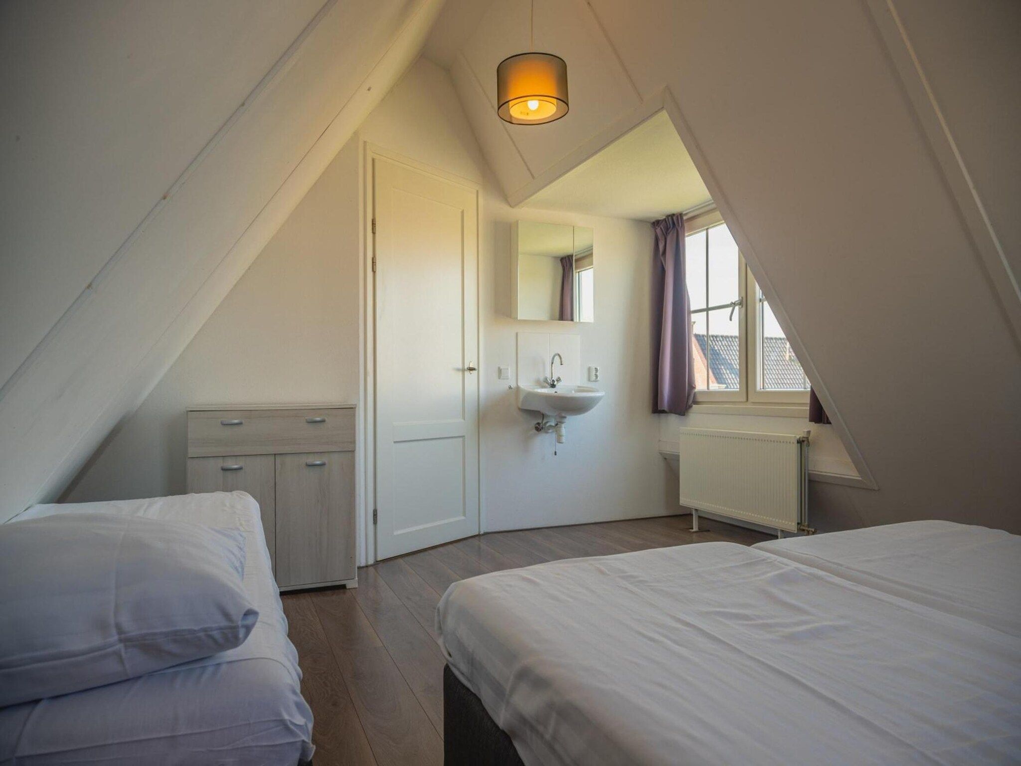 Een slaapkamer van 	Waterland  8 personen in West-Graftdijk