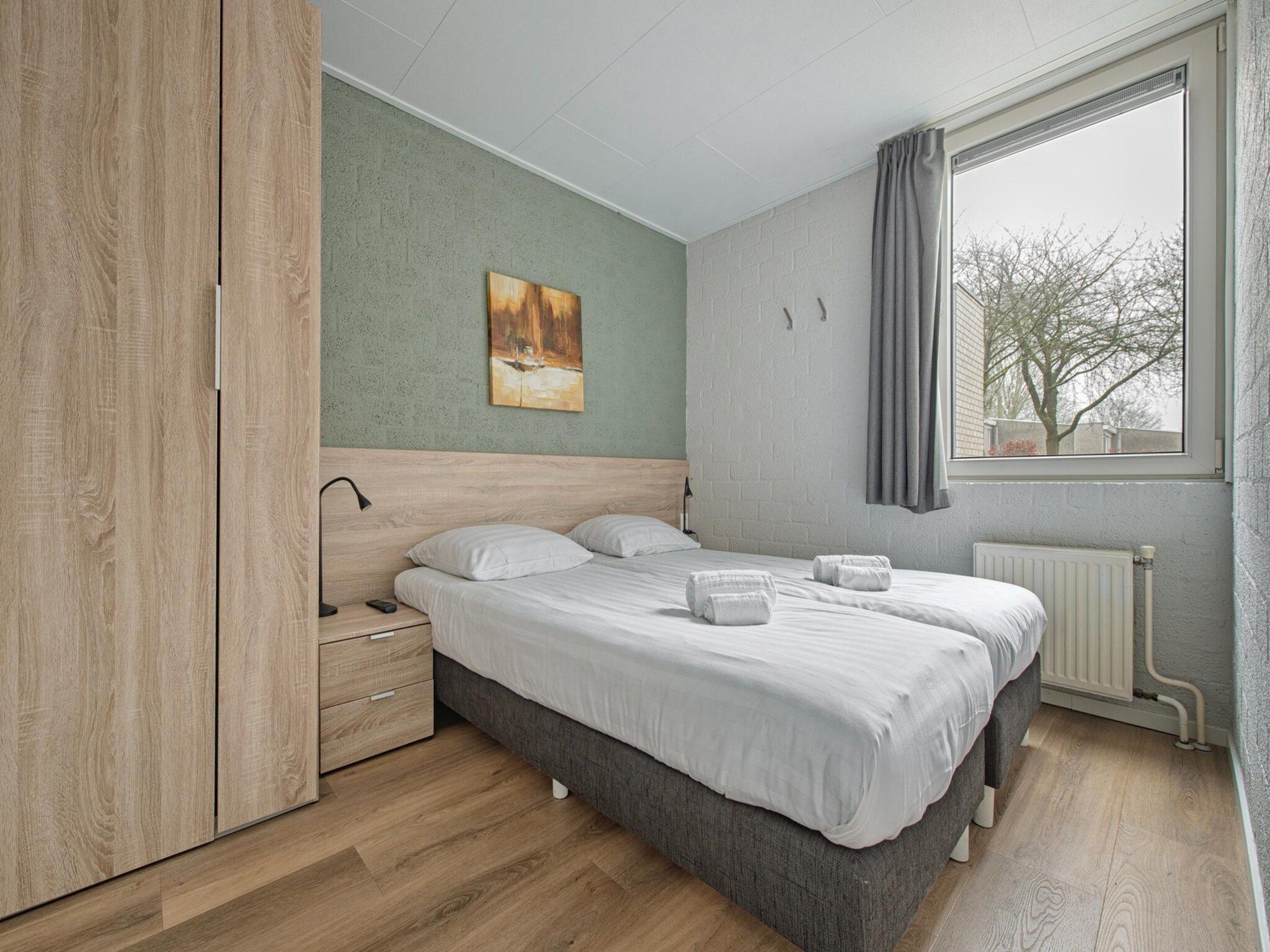 Een slaapkamer van Bungalowpark Schin op Geul 9 in Walem