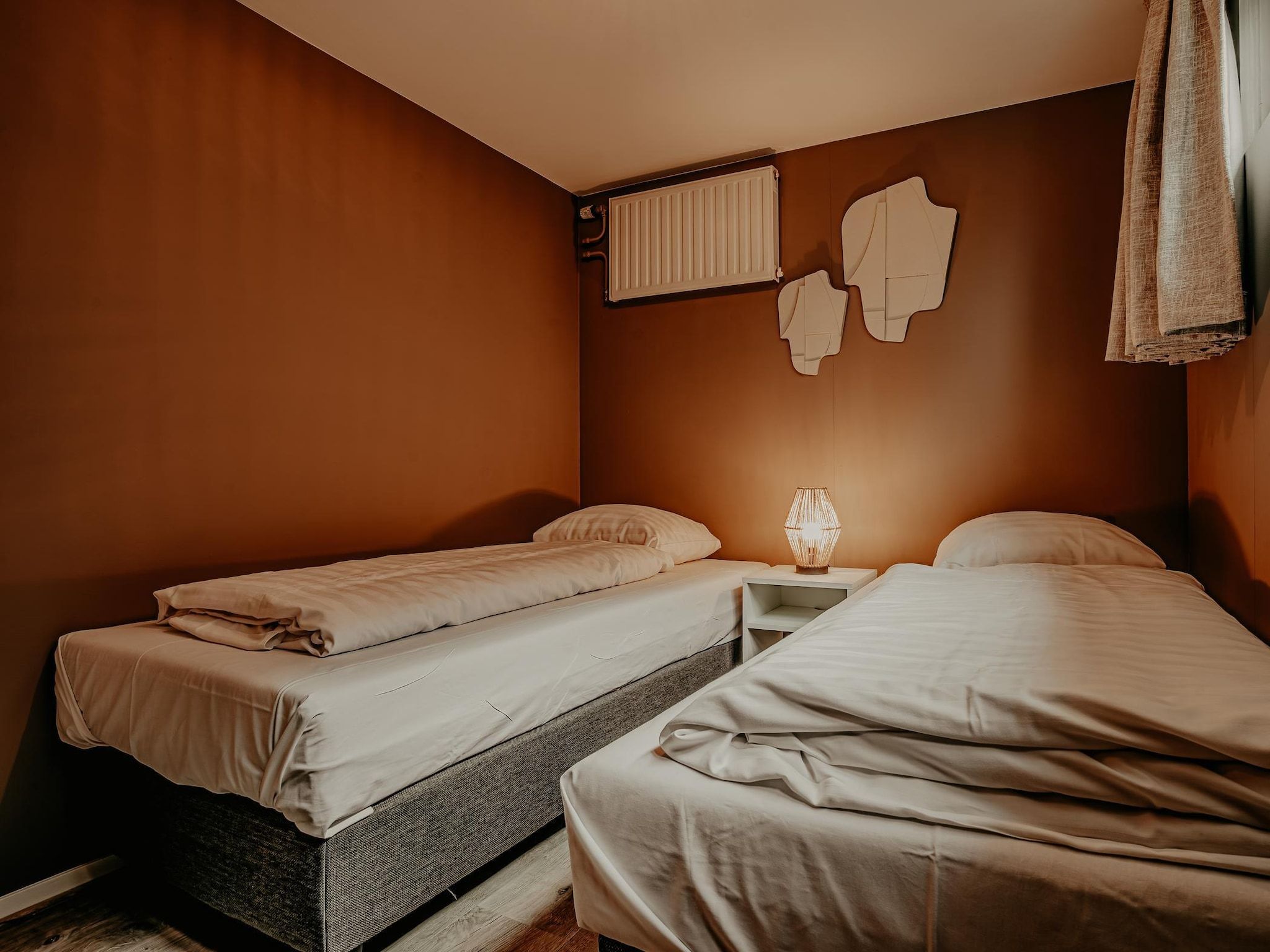 Een slaapkamer van Waterpark de Meerparel 5 in Uitgeest