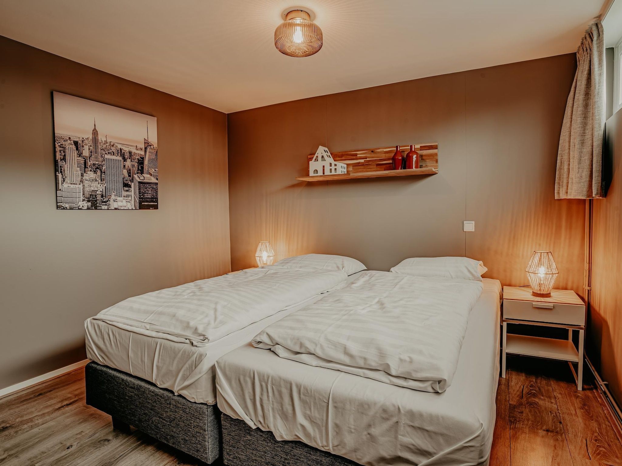 Een slaapkamer van Waterpark de Meerparel 5 in Uitgeest